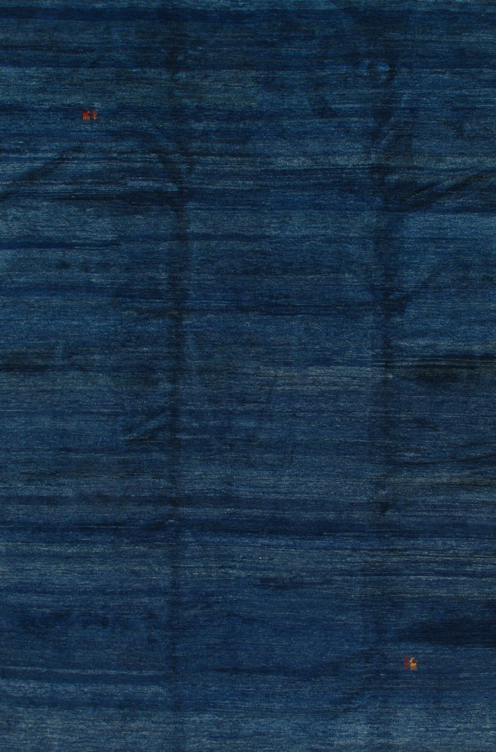 A close up of a blue fabric texture.