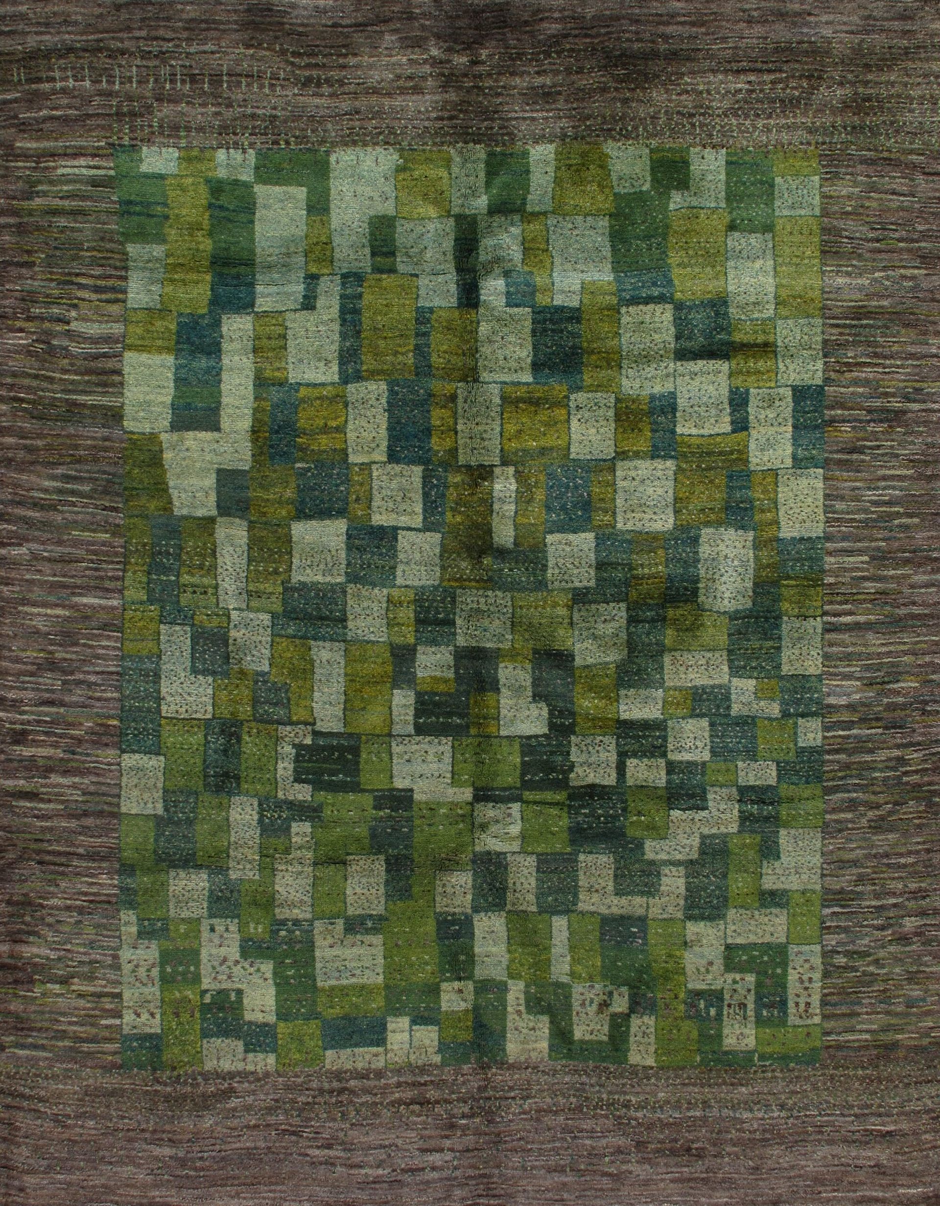 A green and brown rug with a square pattern on it.