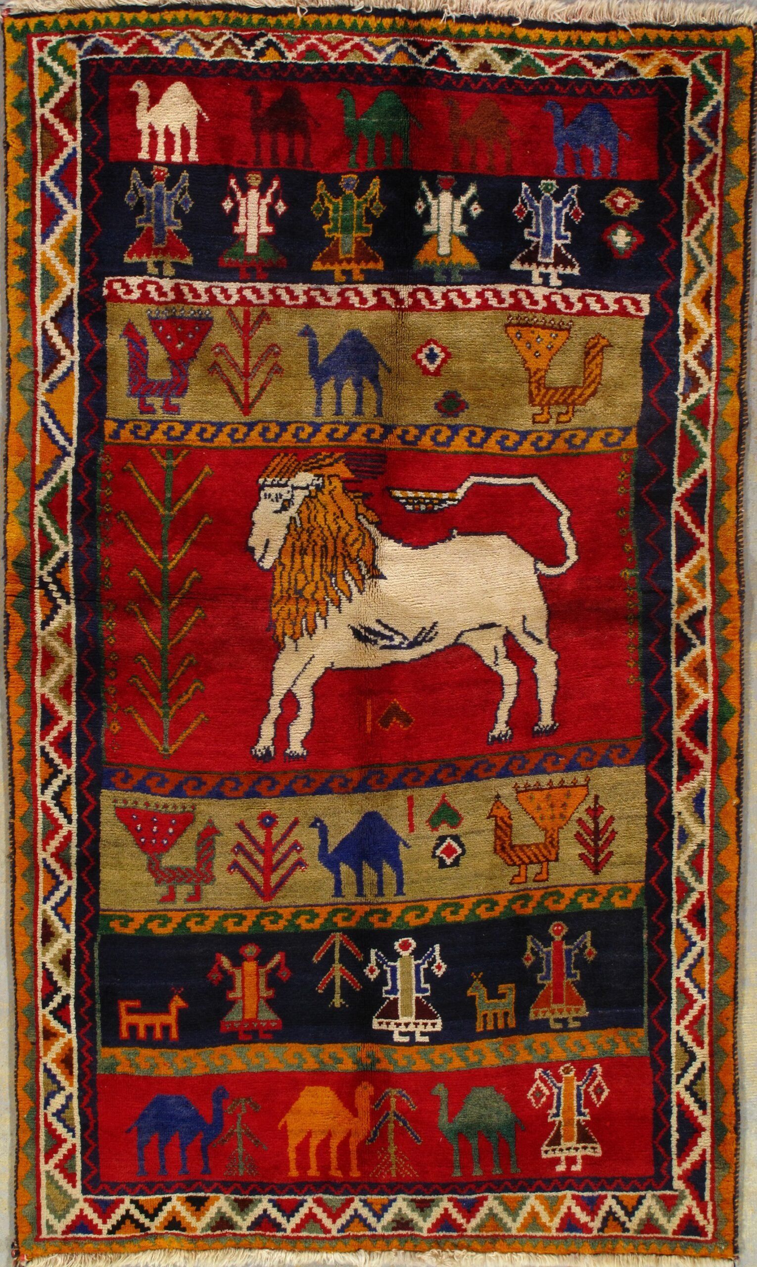 A rug with a lion and camels on it