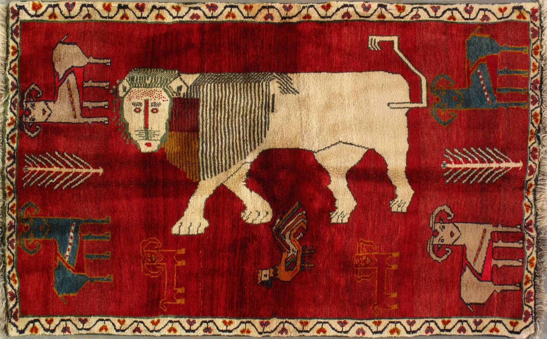 A red rug with a lion on it