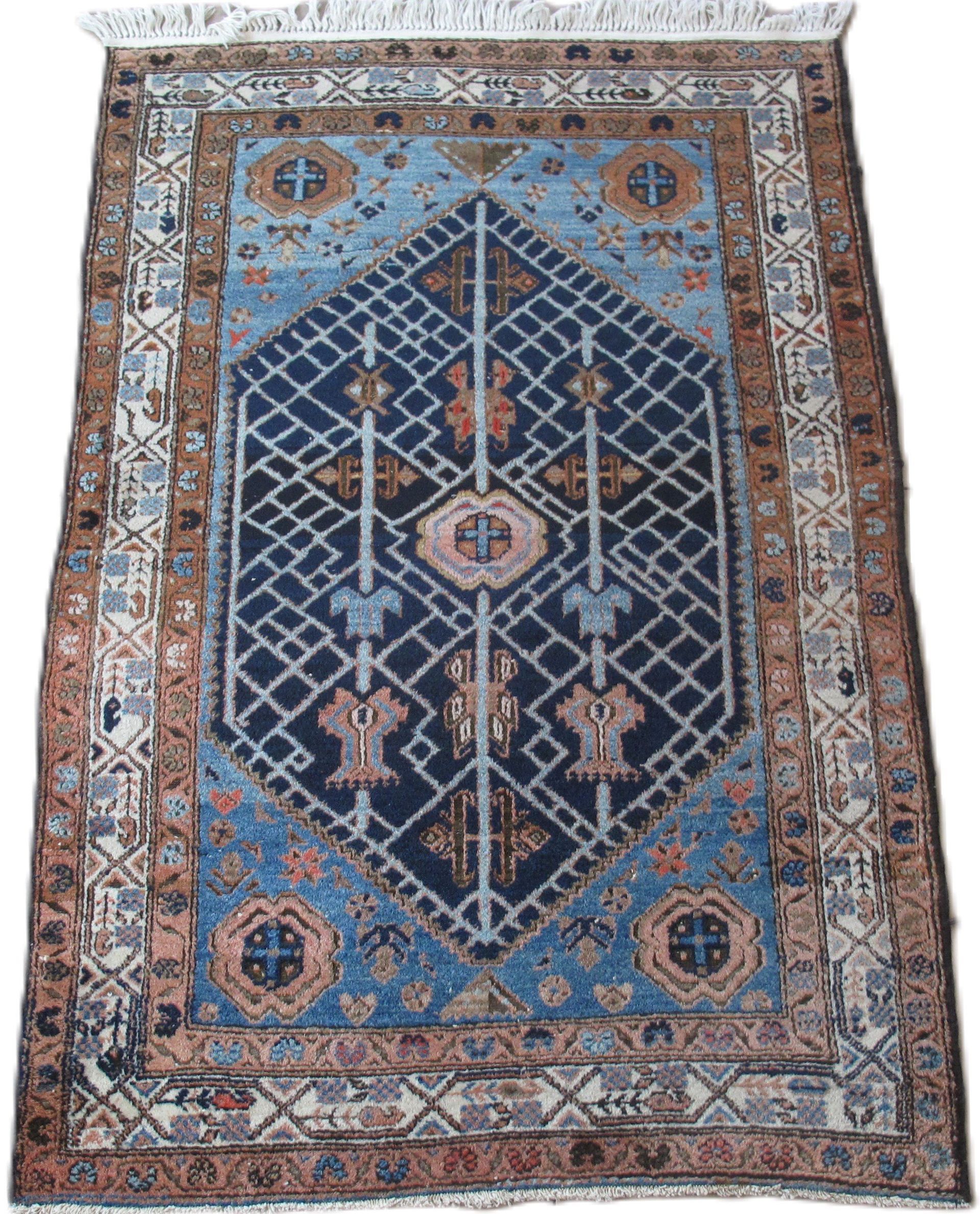 A blue and brown rug with a geometric pattern on it