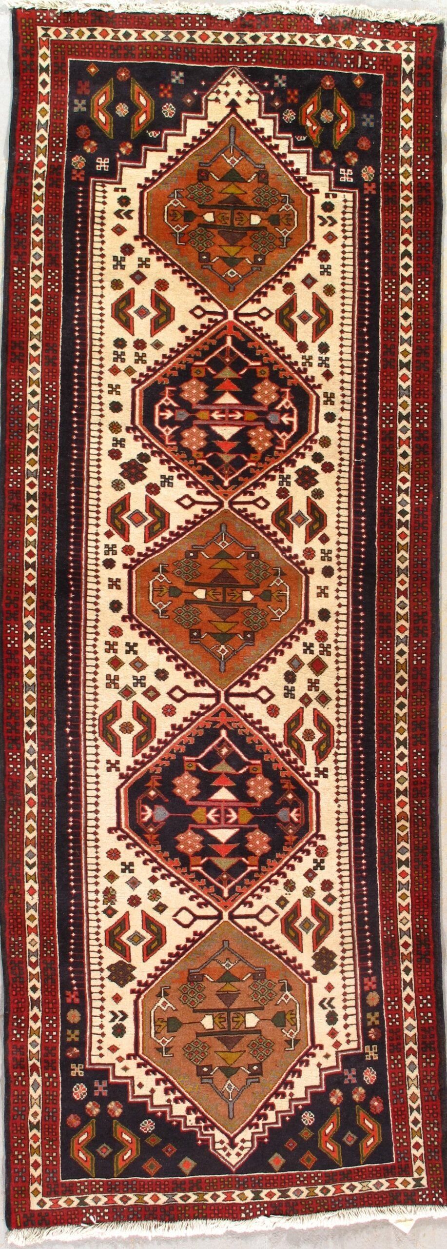 A rug with a pattern on it is sitting on a table.