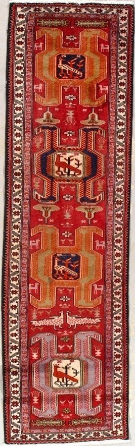 A red rug with a geometric pattern on it