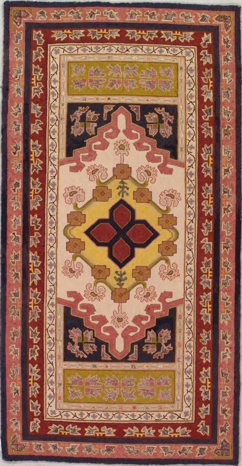 A rug with a red and yellow design on it