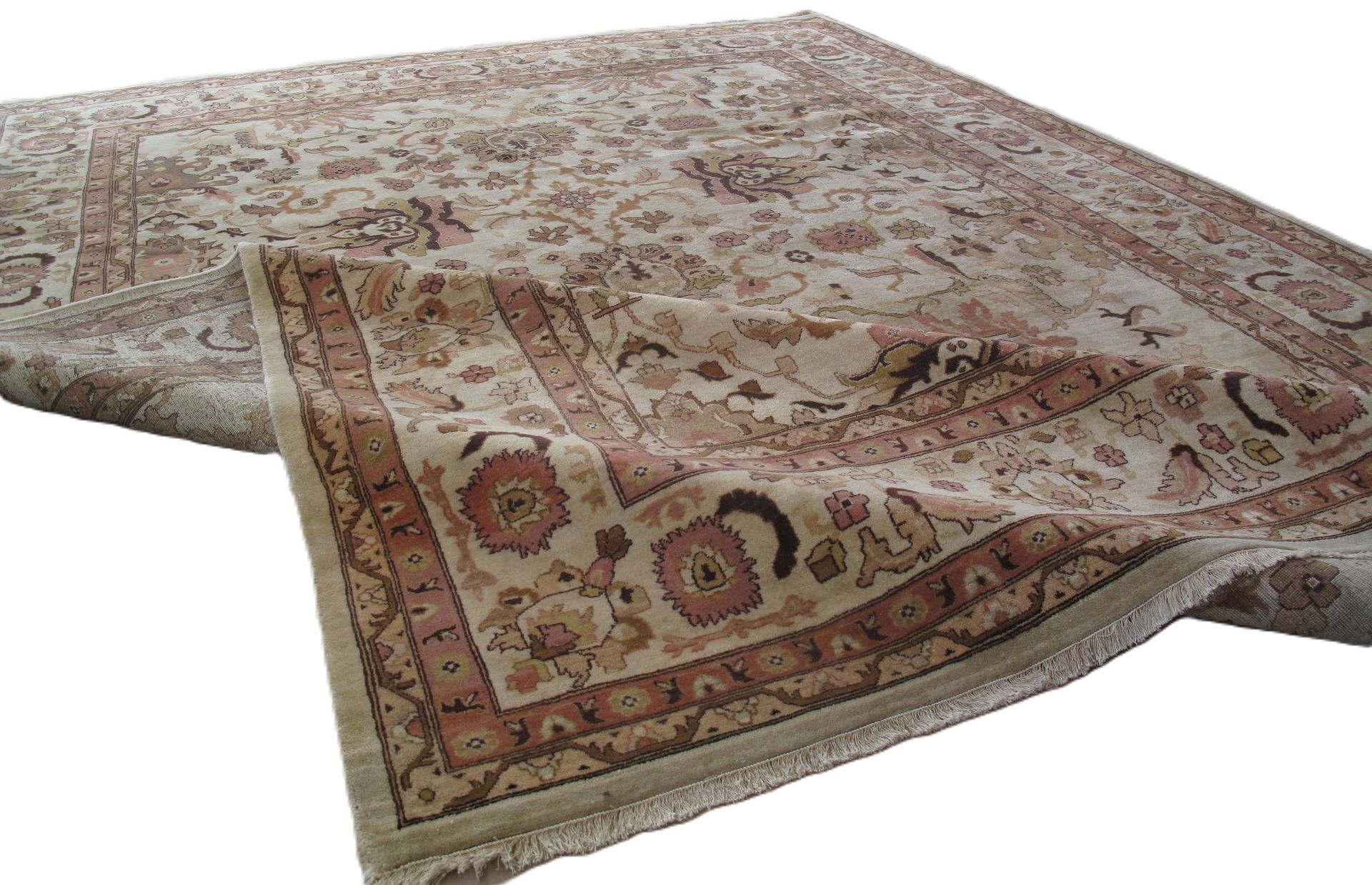 A rug with a floral pattern on it is on a white background.