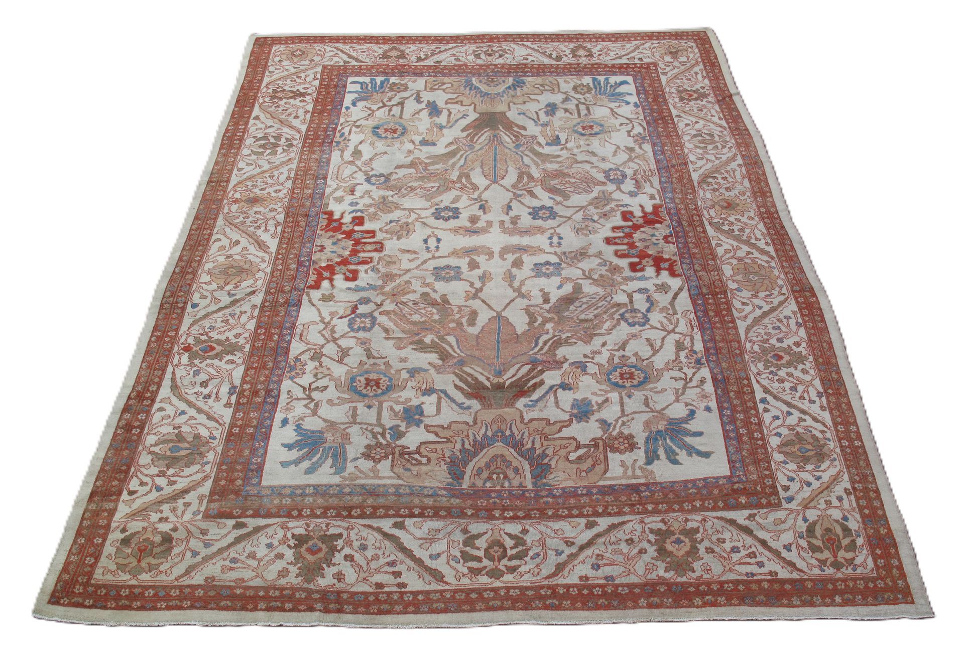 A rug with a floral pattern on it is on a white background.