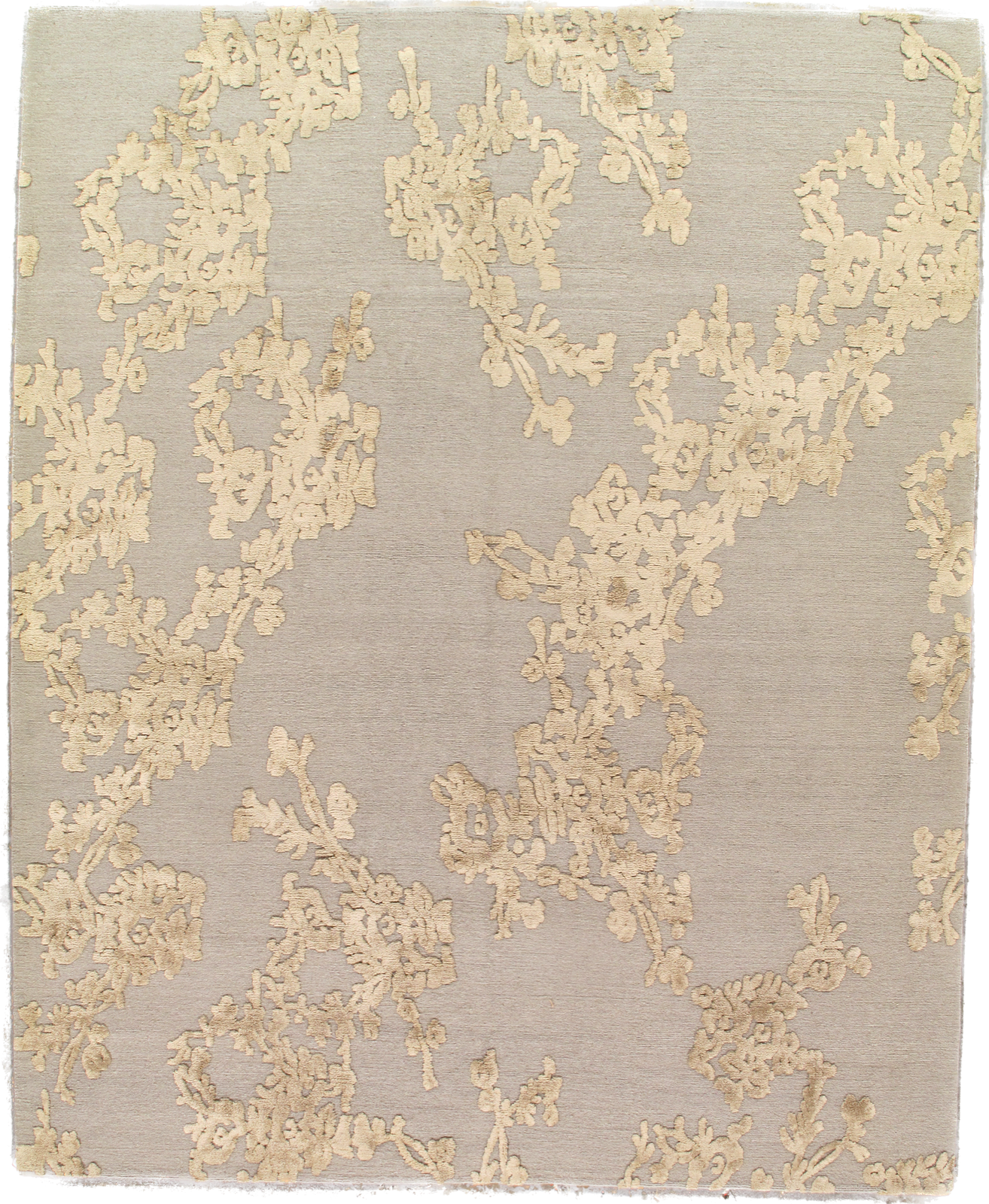 A square rug with a floral pattern on it