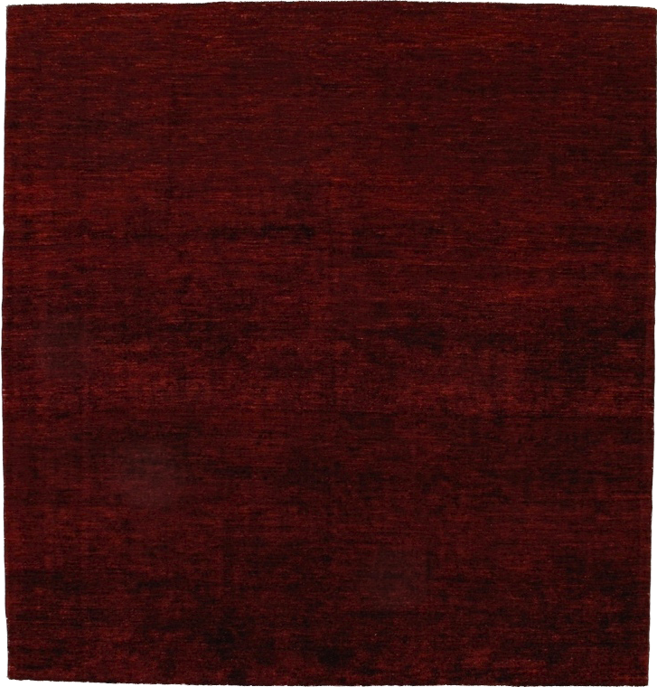 A close up of a red rug on a white background