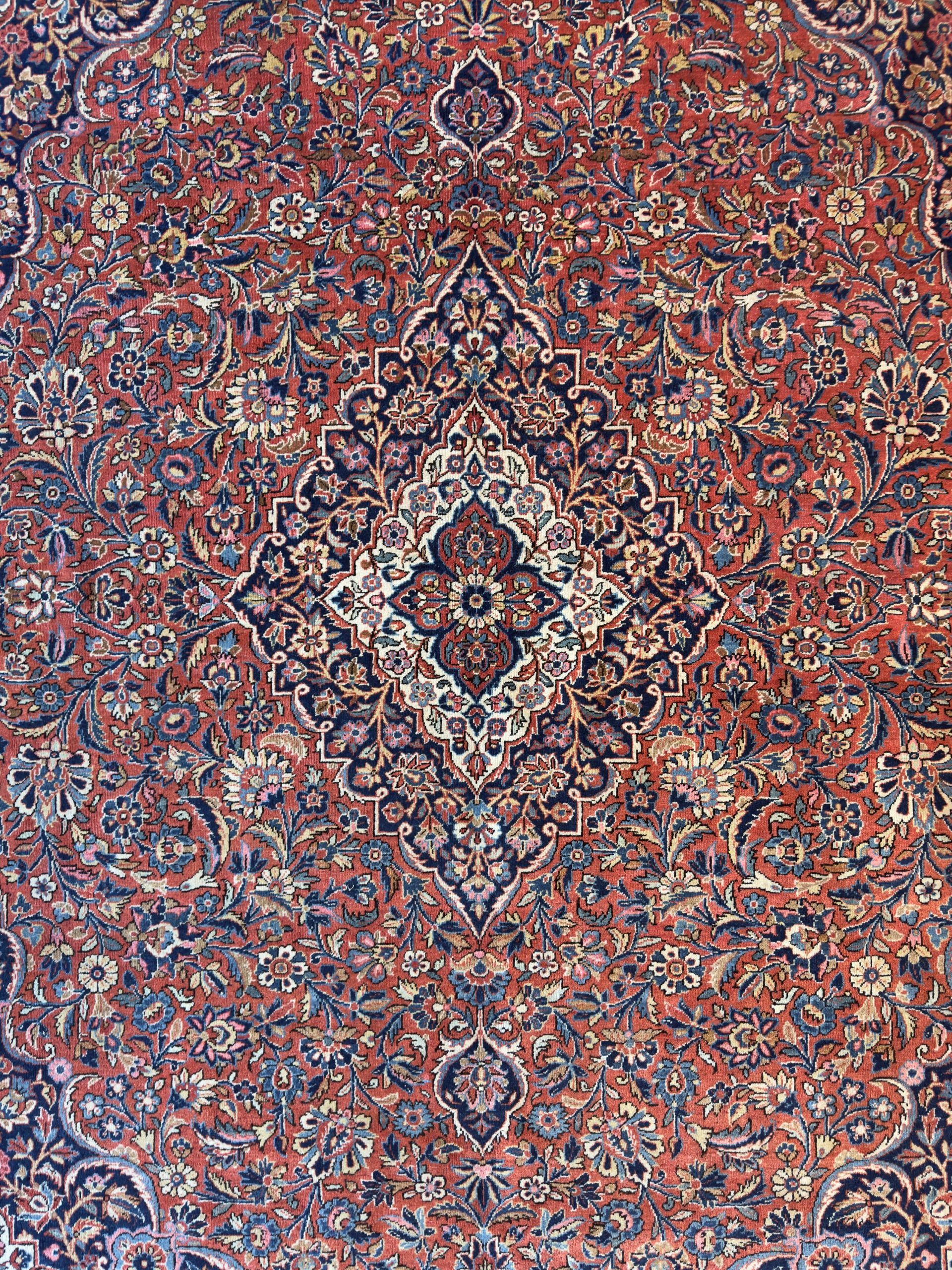 A rug with a pattern on it is on a white background.