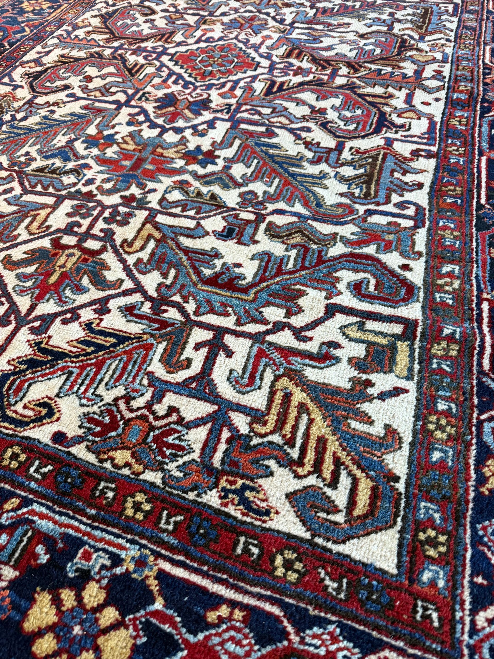 A rug with a floral pattern is sitting on a white surface.