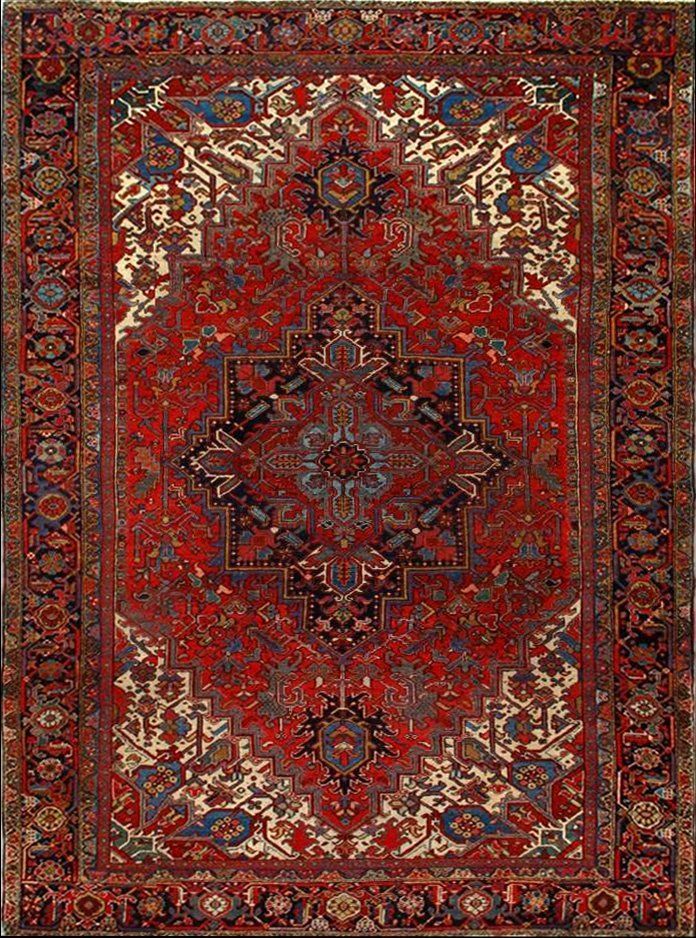 A red rug with a pattern on it is sitting on a table.