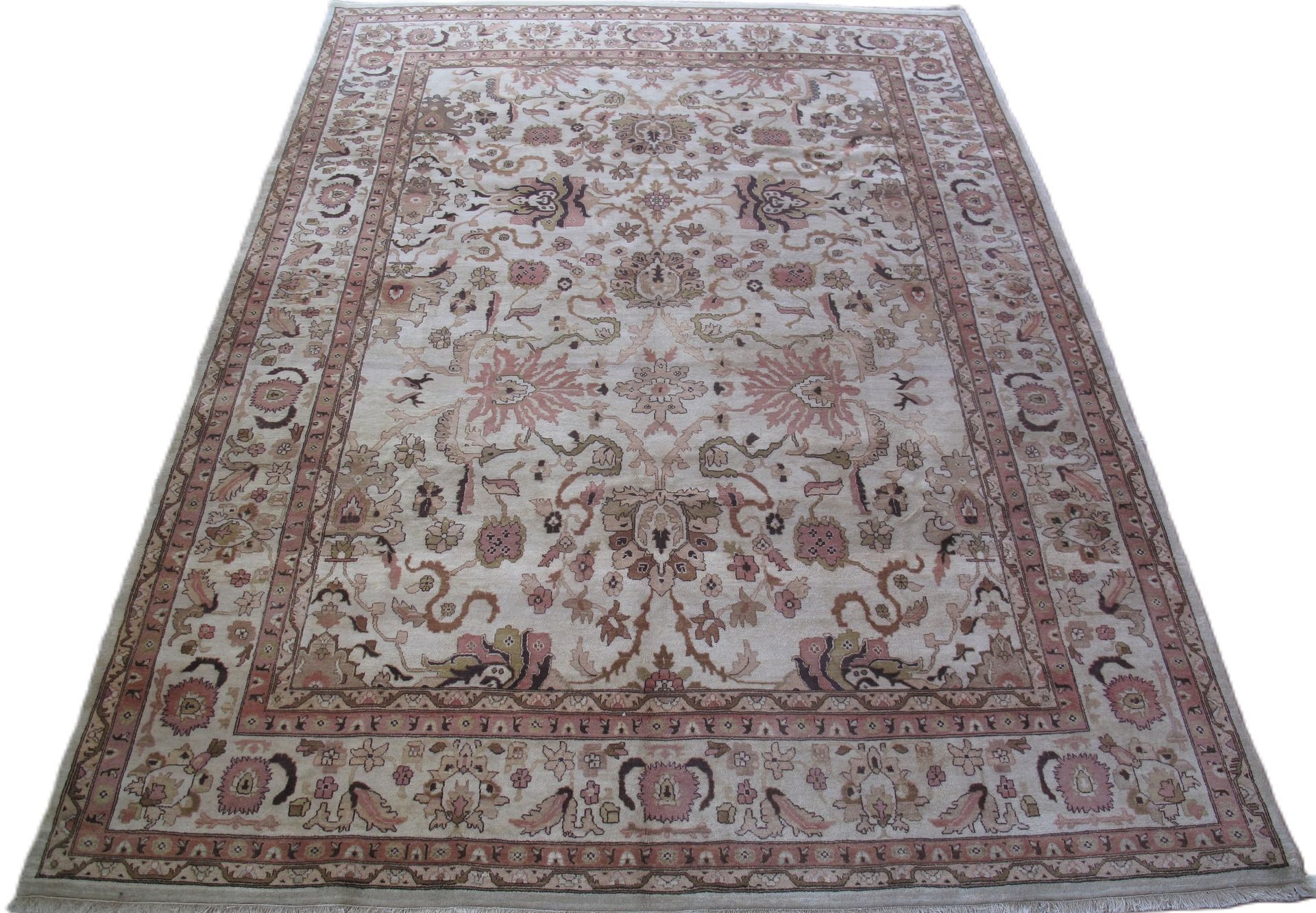 A rug with a floral pattern on it is on a white background.