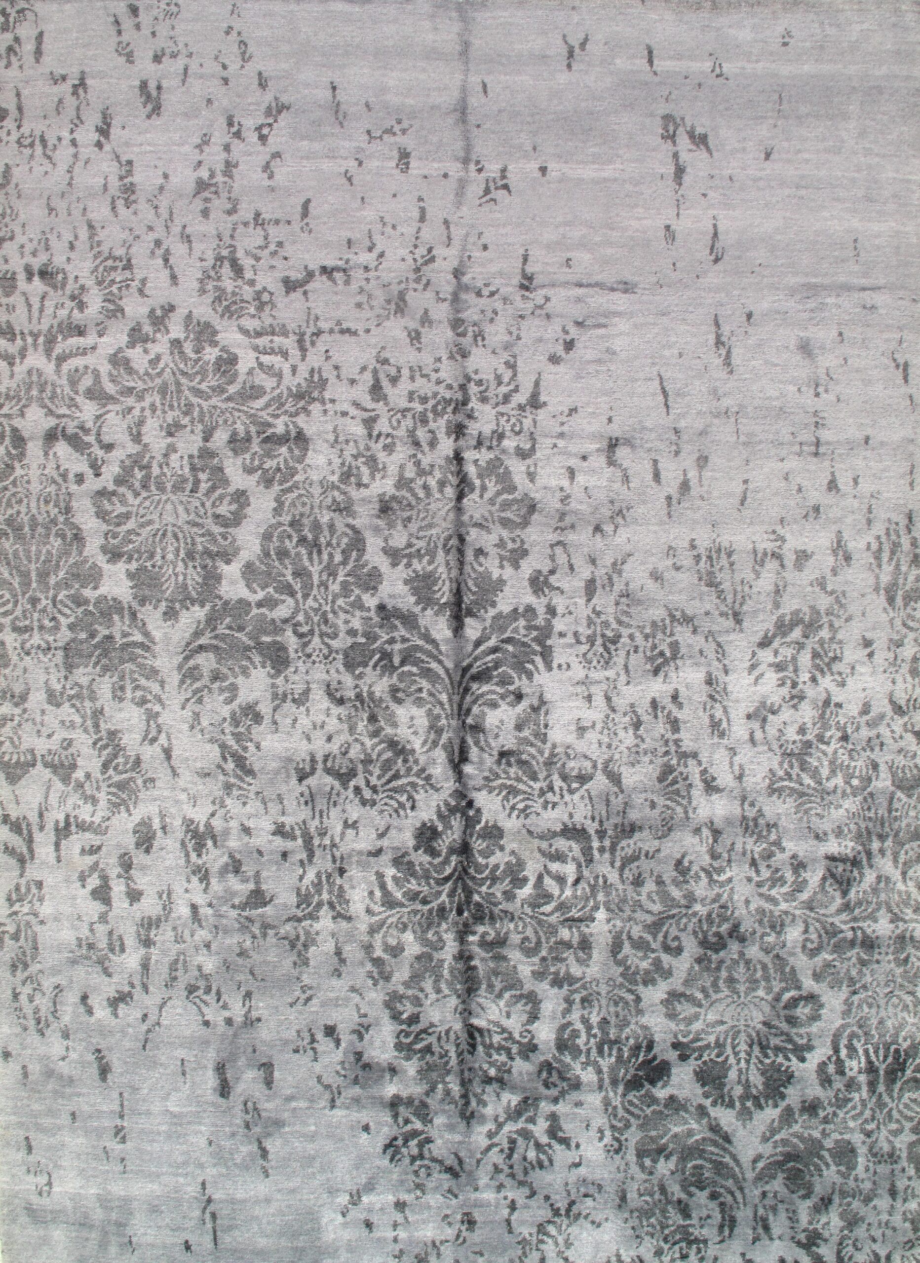 A close up of a gray rug with a pattern on it.
