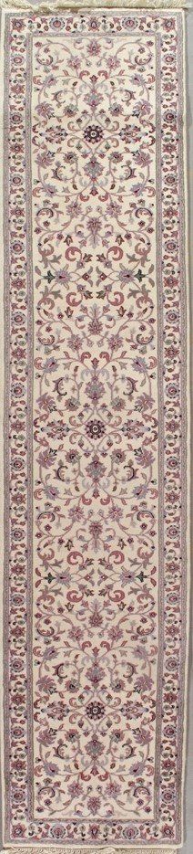 A rug with a pattern on it is hanging on a wall.