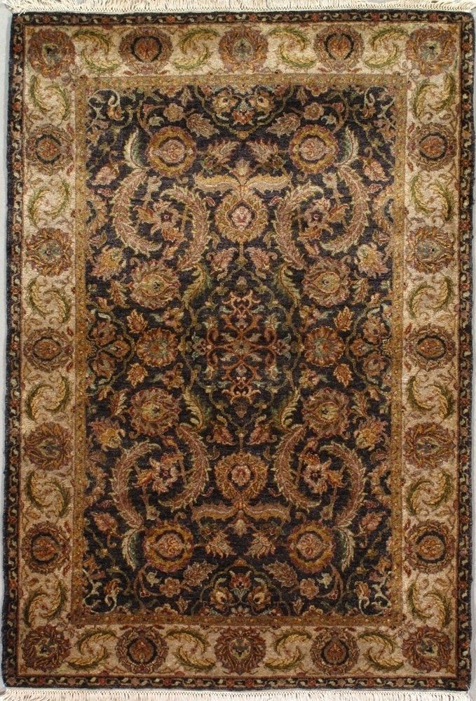 A rug with a floral pattern on it is sitting on a table.