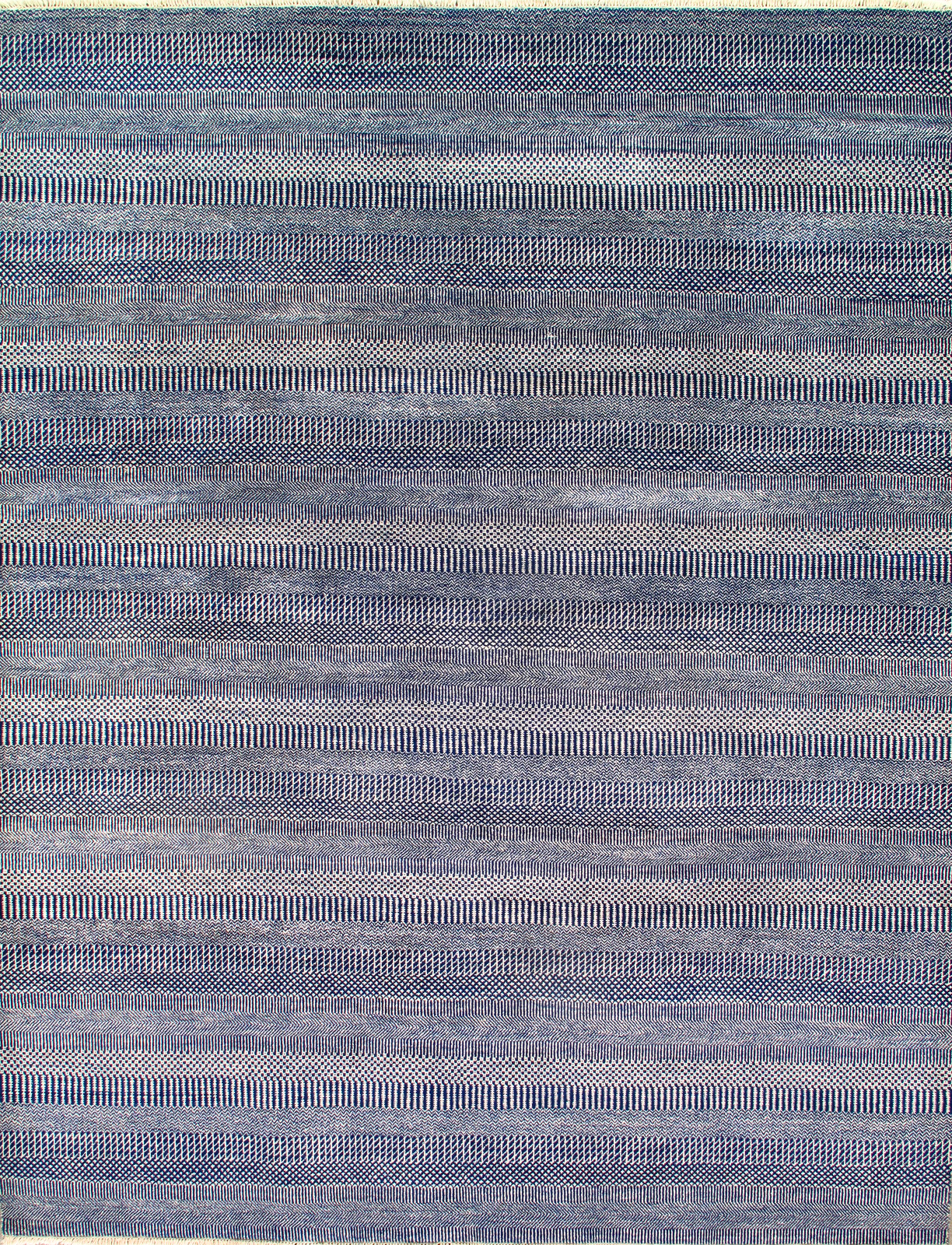 A close up of a colorful rug with a pattern on it.