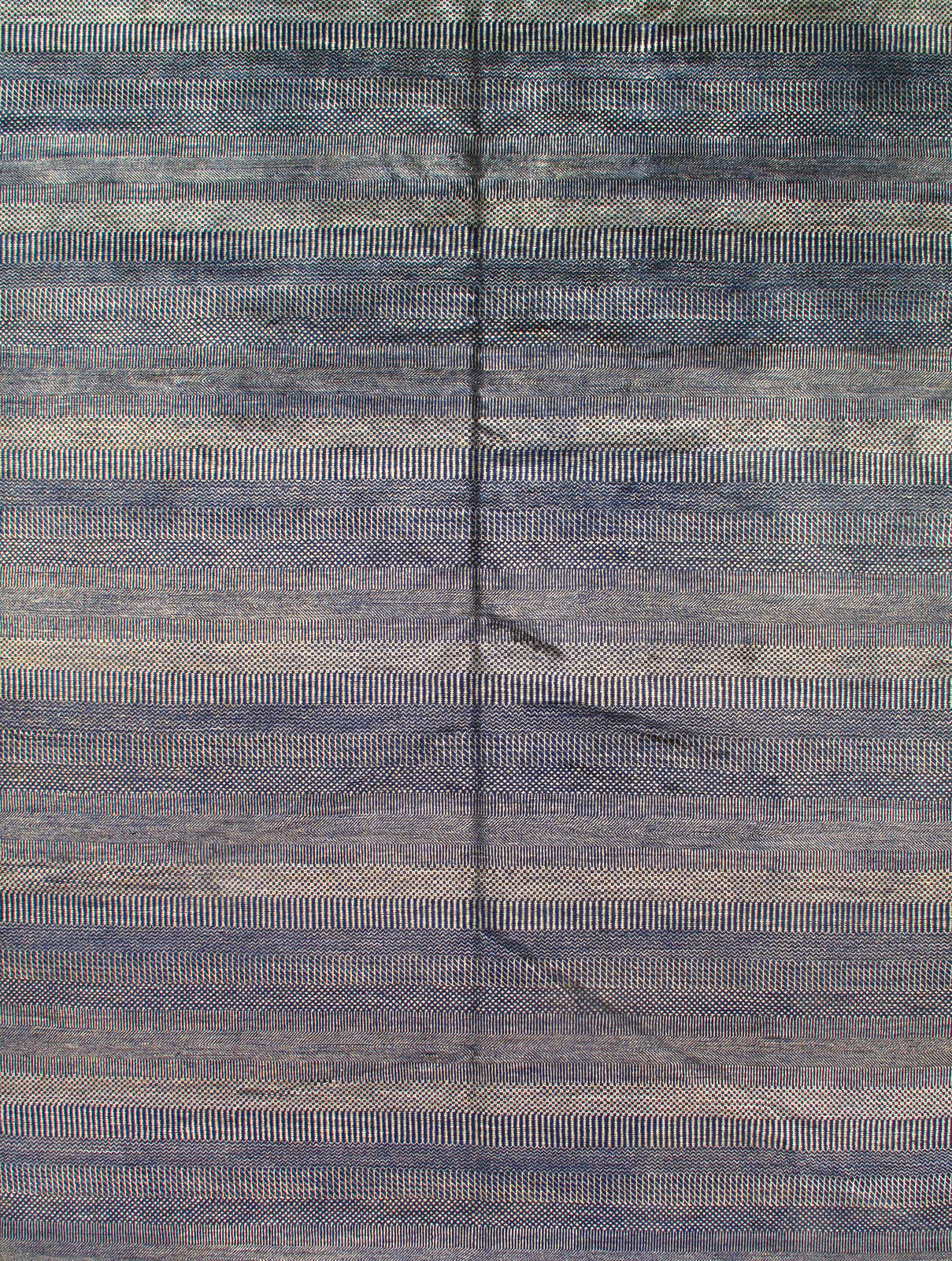 A close up of a colorful rug with a pattern on it.