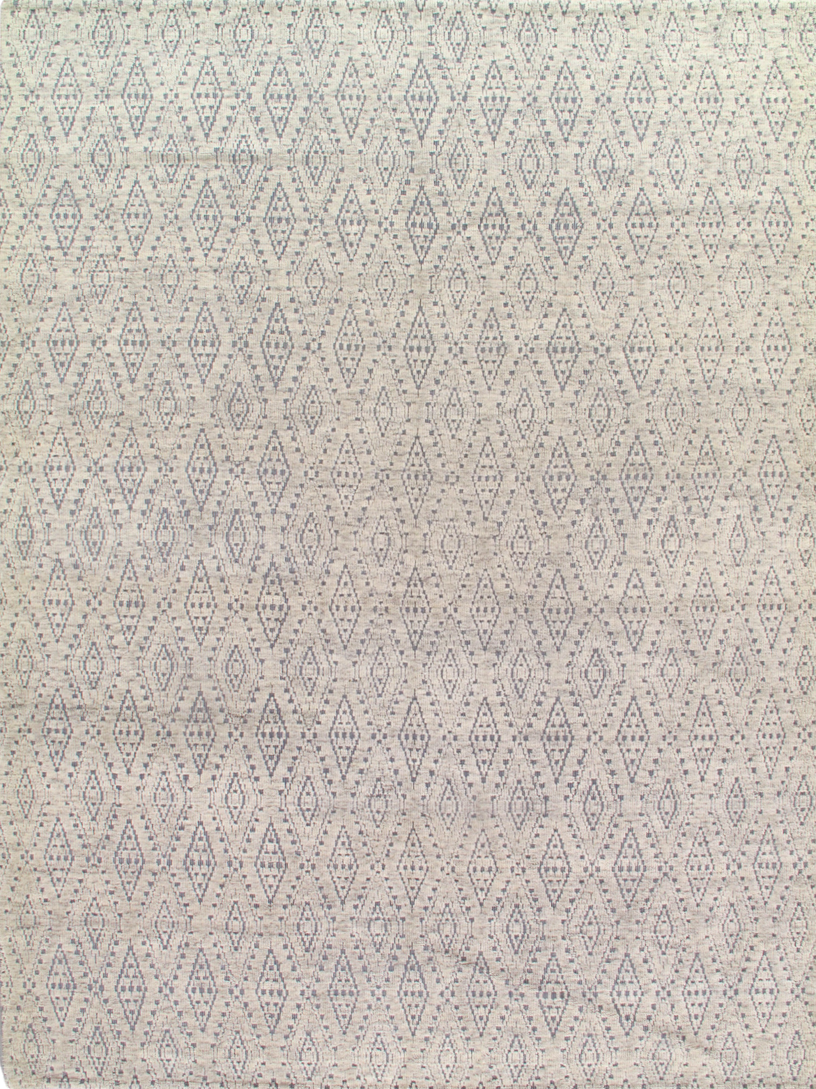 A close up of a white rug with a pattern on it.