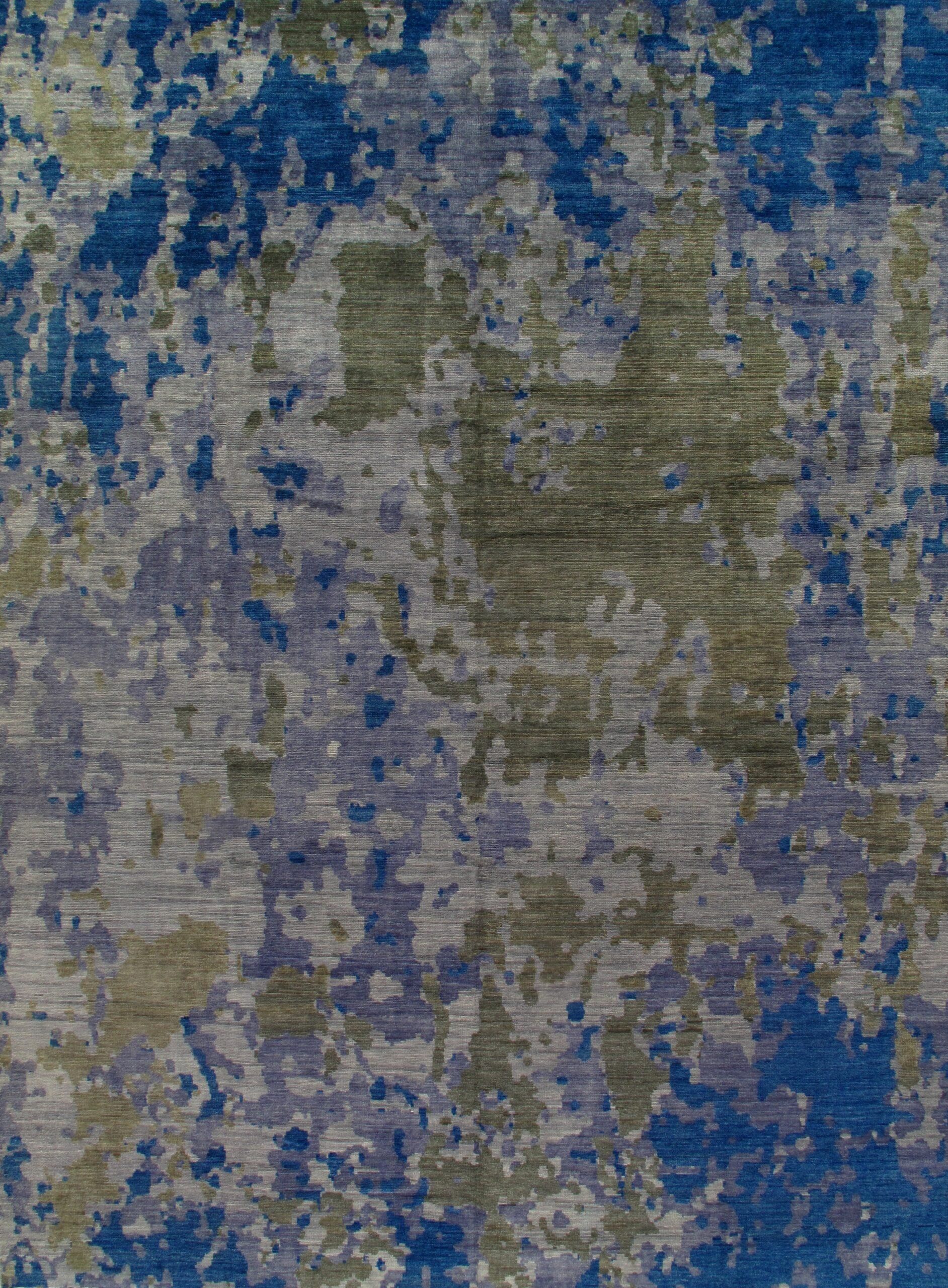 A close up of a blue and gray rug with a camouflage pattern.