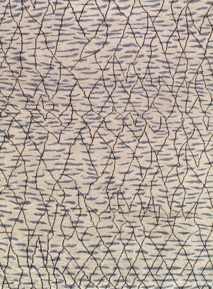 A close up of a rug with a geometric pattern on it.