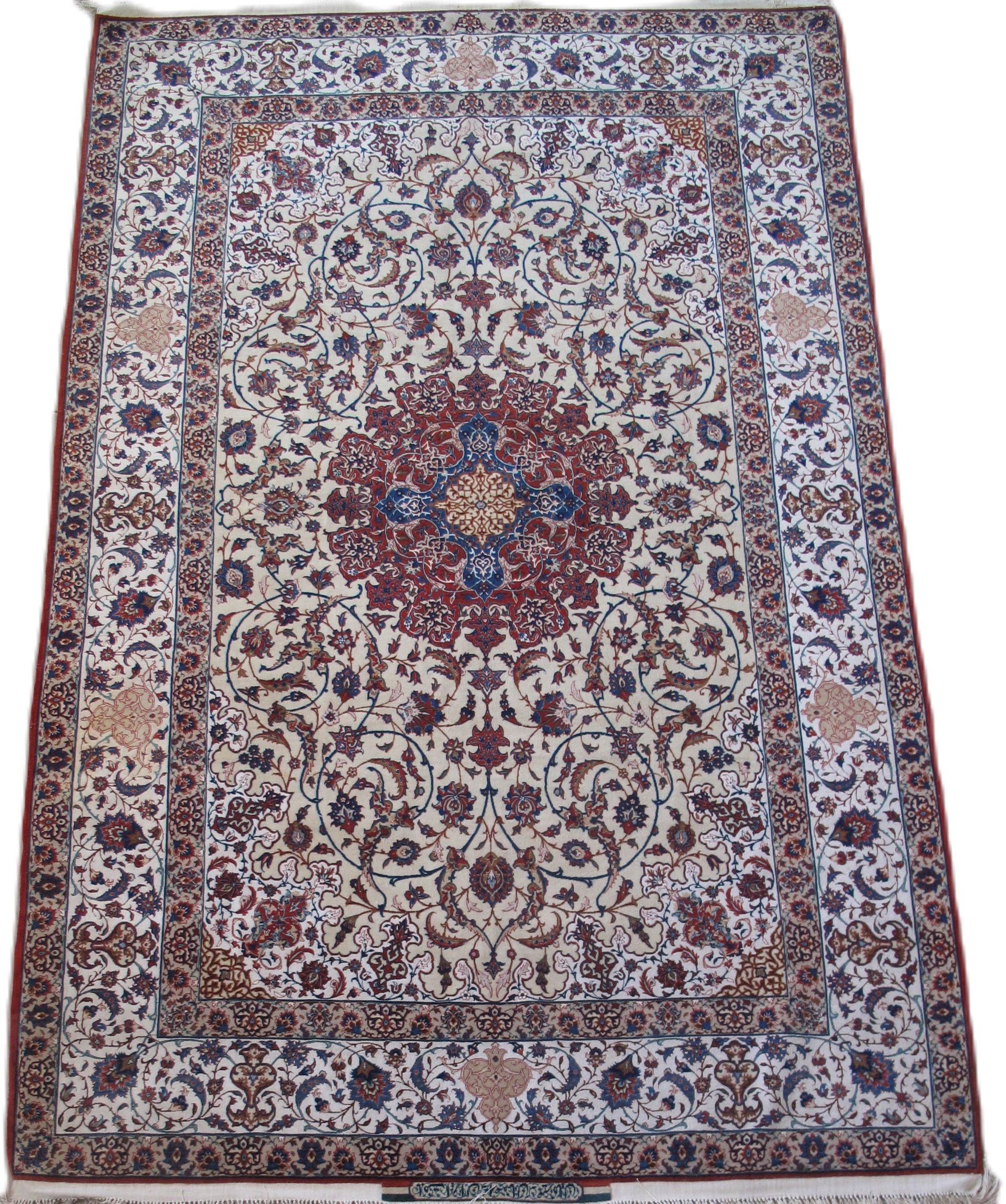 A rug with a floral pattern on it is sitting on a white surface.