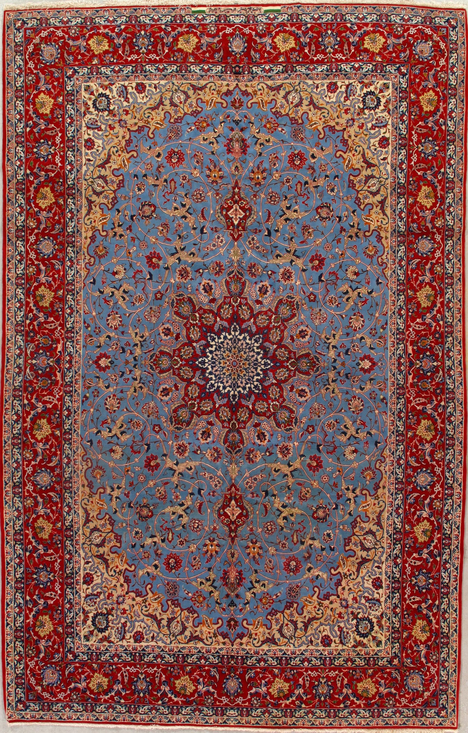 A blue and red rug with a floral pattern on it.
