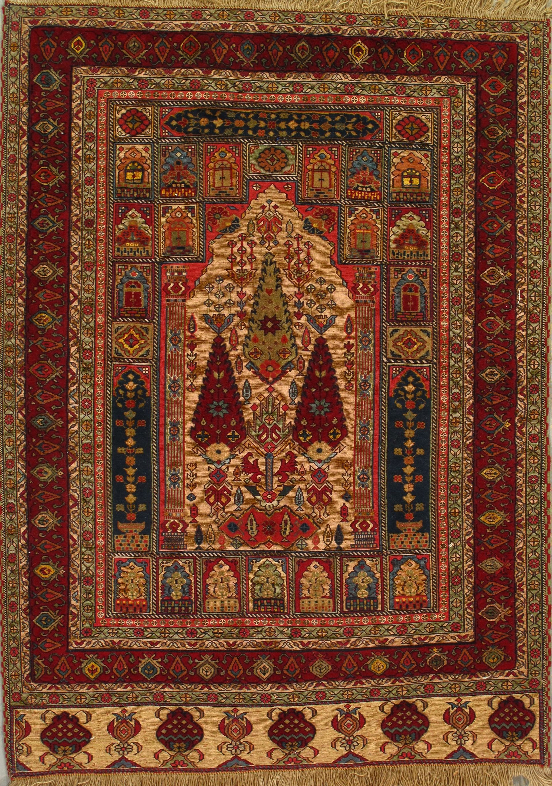 A rug with a red and gold border and trees on it