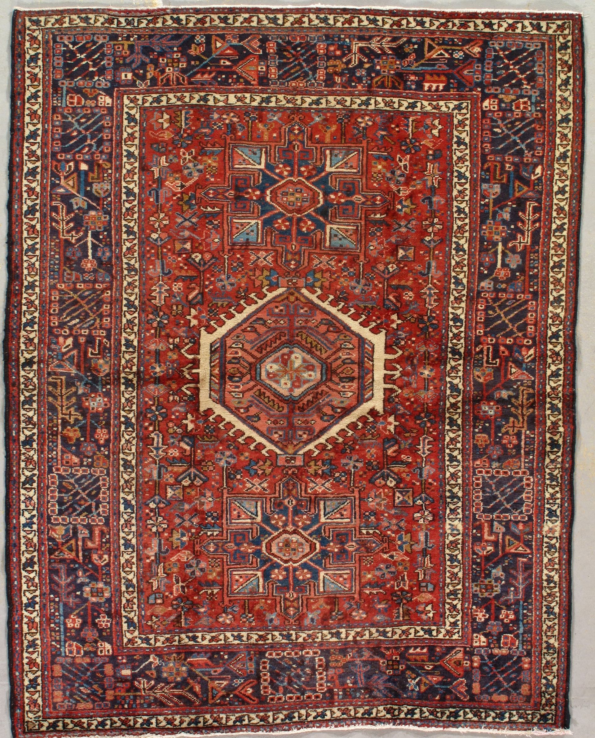A rug with a geometric pattern on it is sitting on a table.