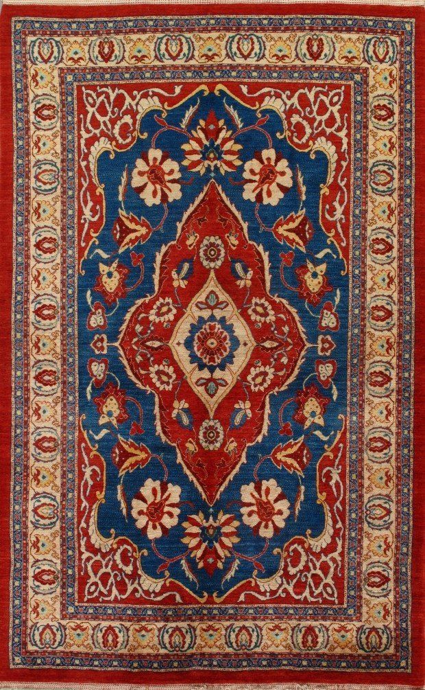 A red , blue and white rug with a floral pattern on it.