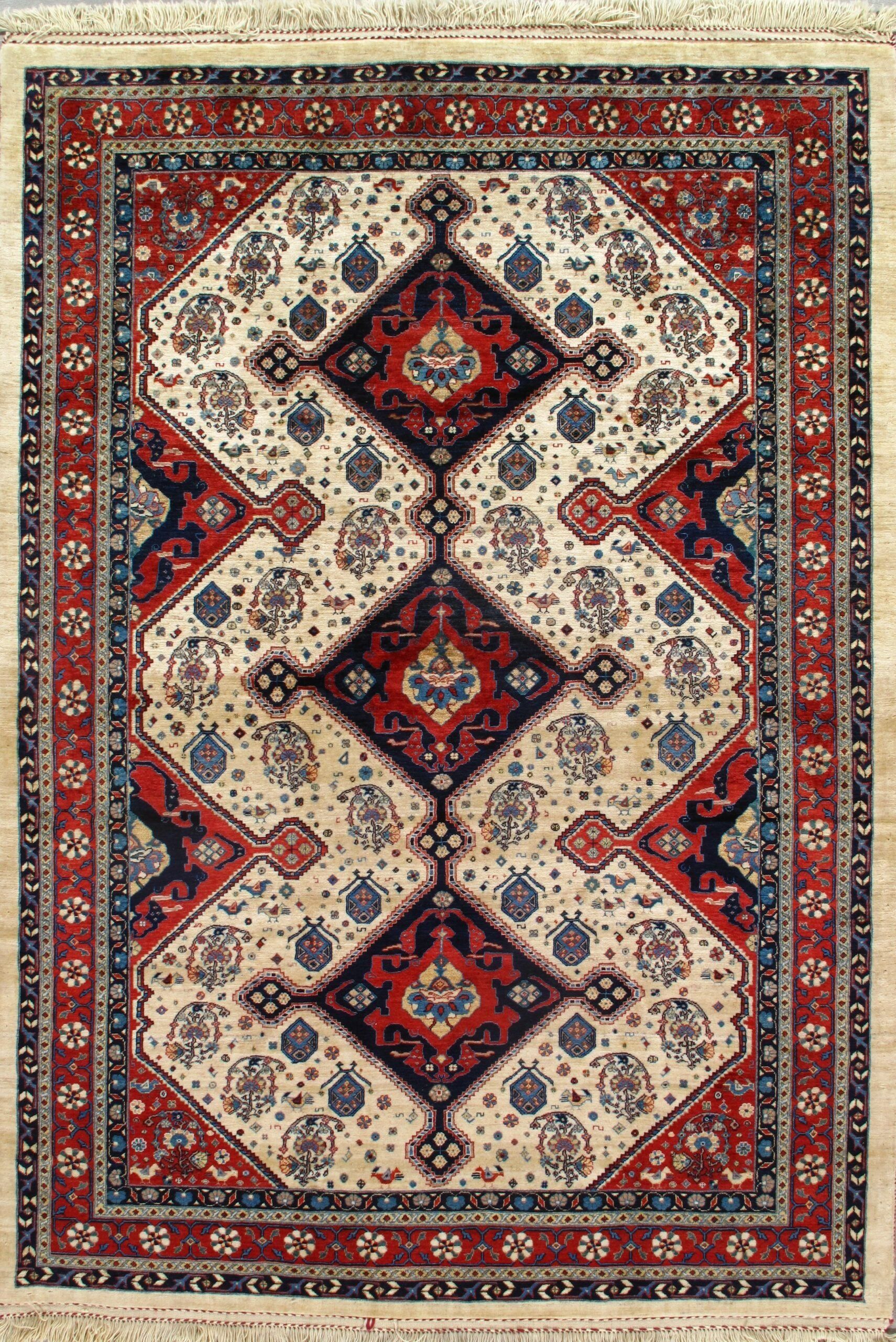 A rug with a red , white , and blue pattern on it.