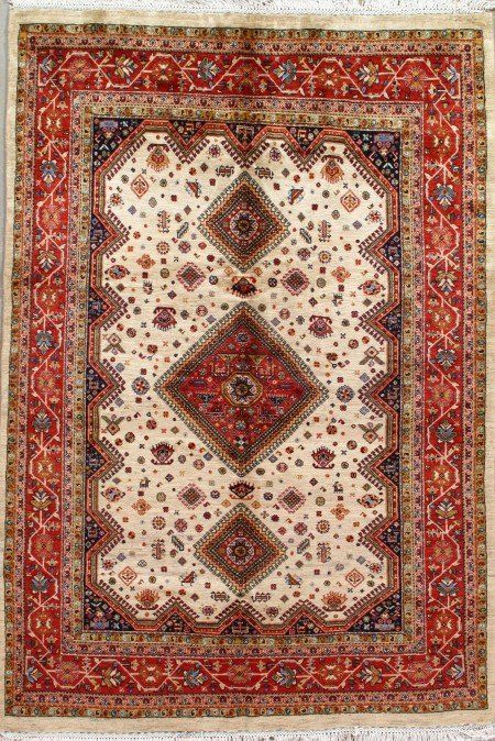 A rug with a pattern on it is sitting on a table.