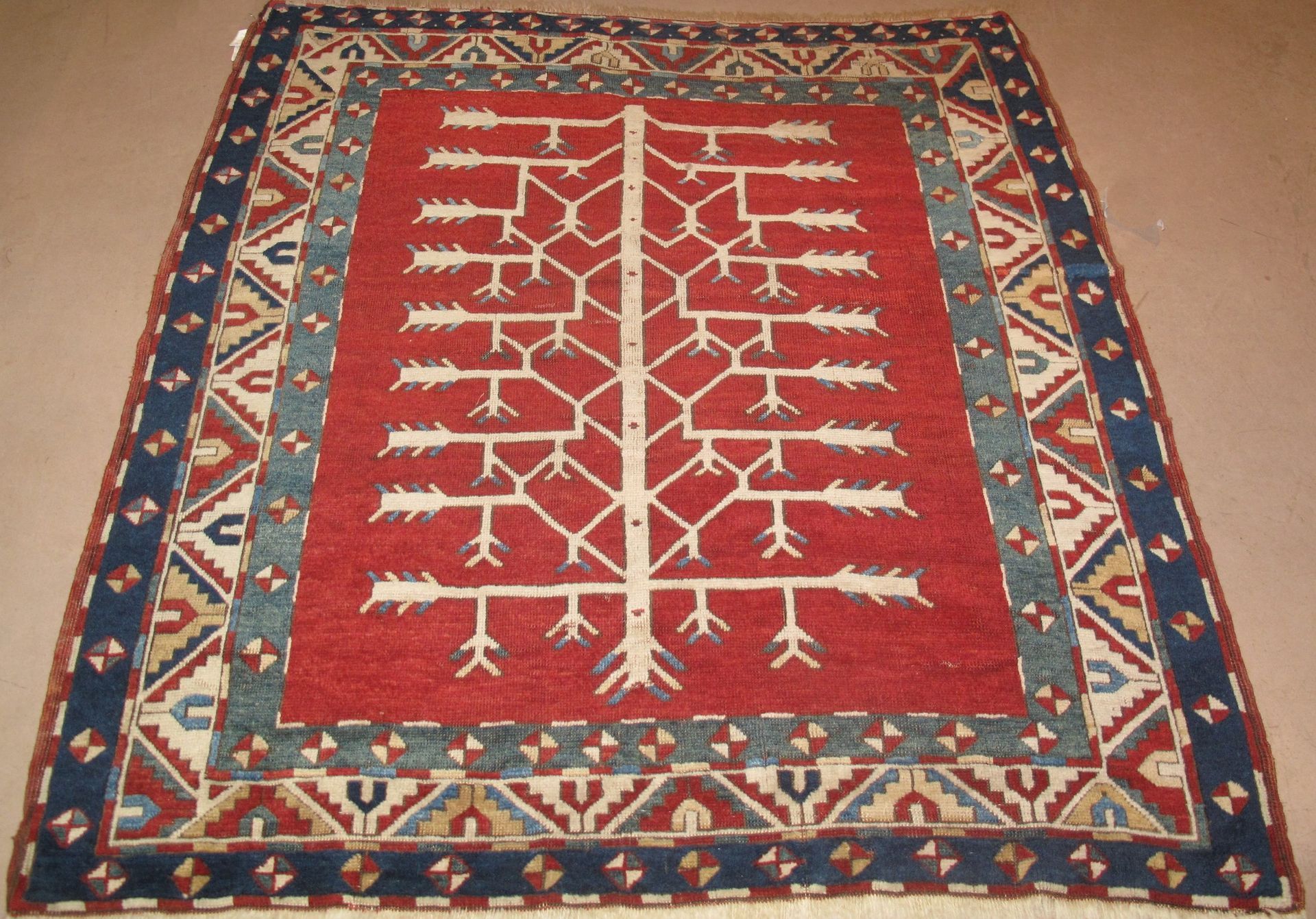 A rug with a tree and arrows on it