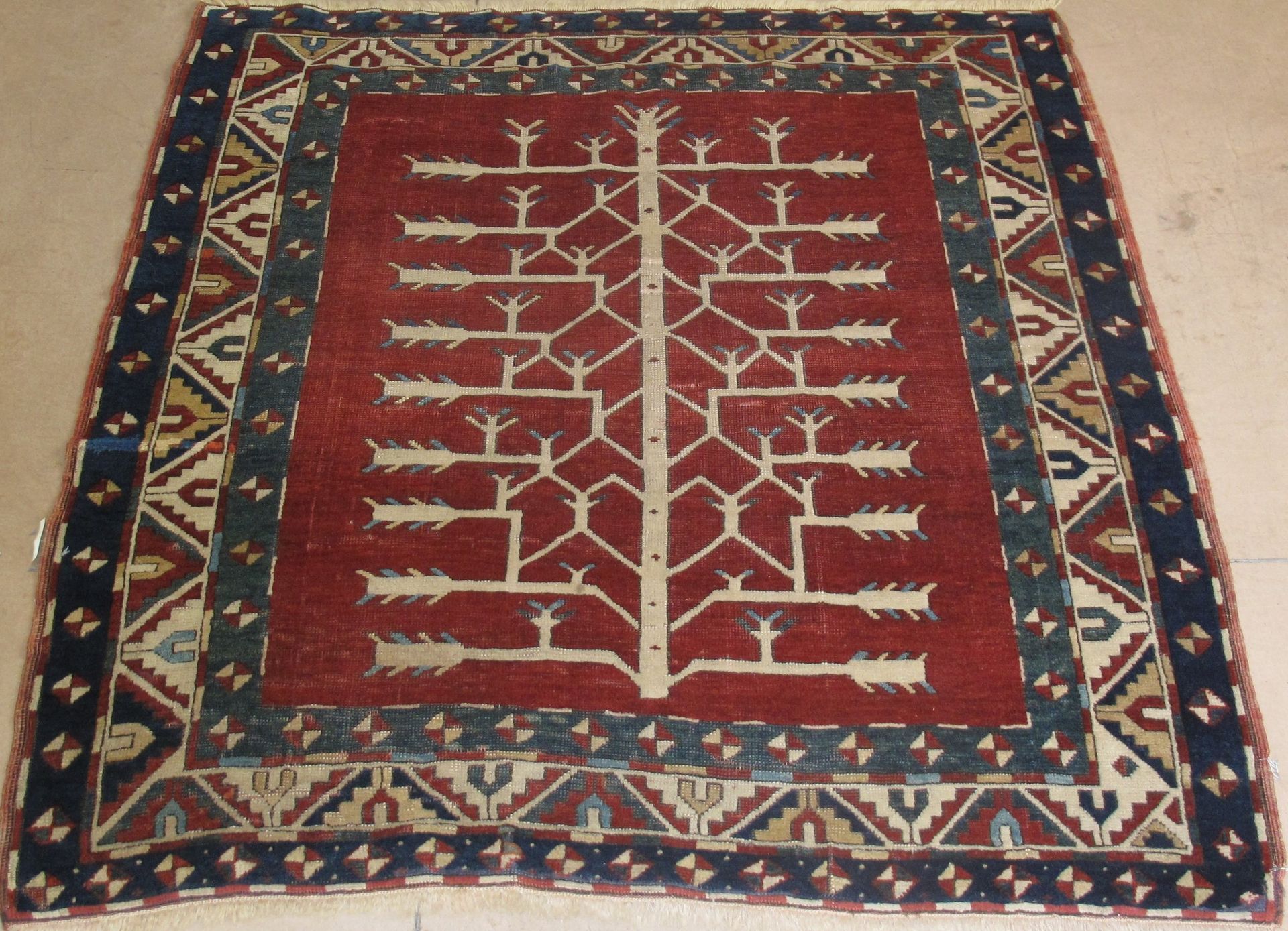 A rug with a tree and arrows on it