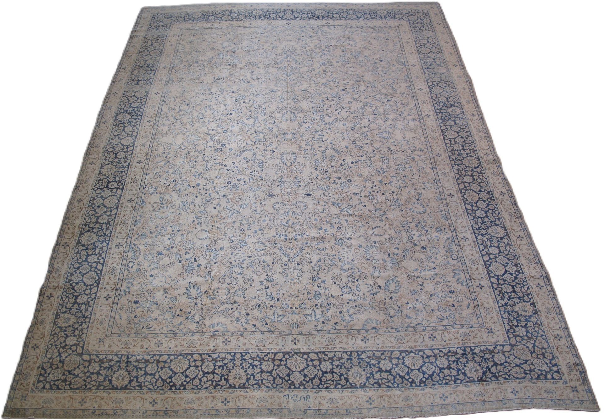 A rug with a black border is on a white background