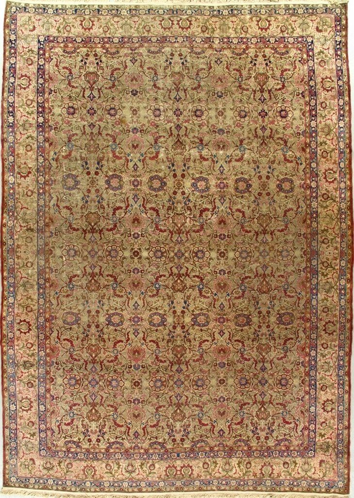 A rug with a floral pattern on it is on a white background.