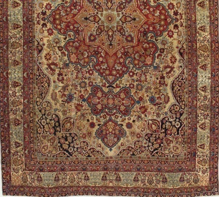 A close up of a rug with a floral pattern on it.