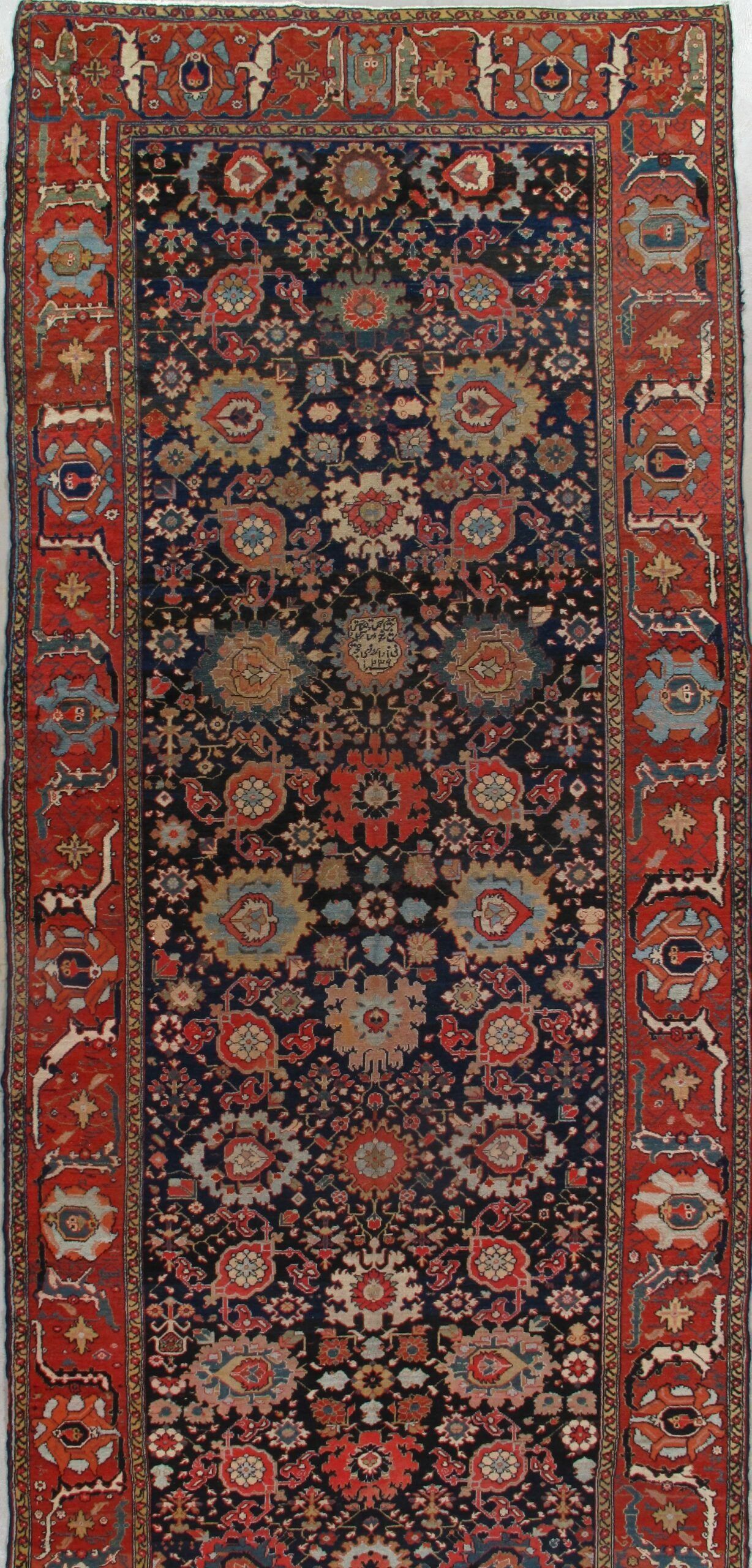 A rug with a floral pattern on it is sitting on a table.