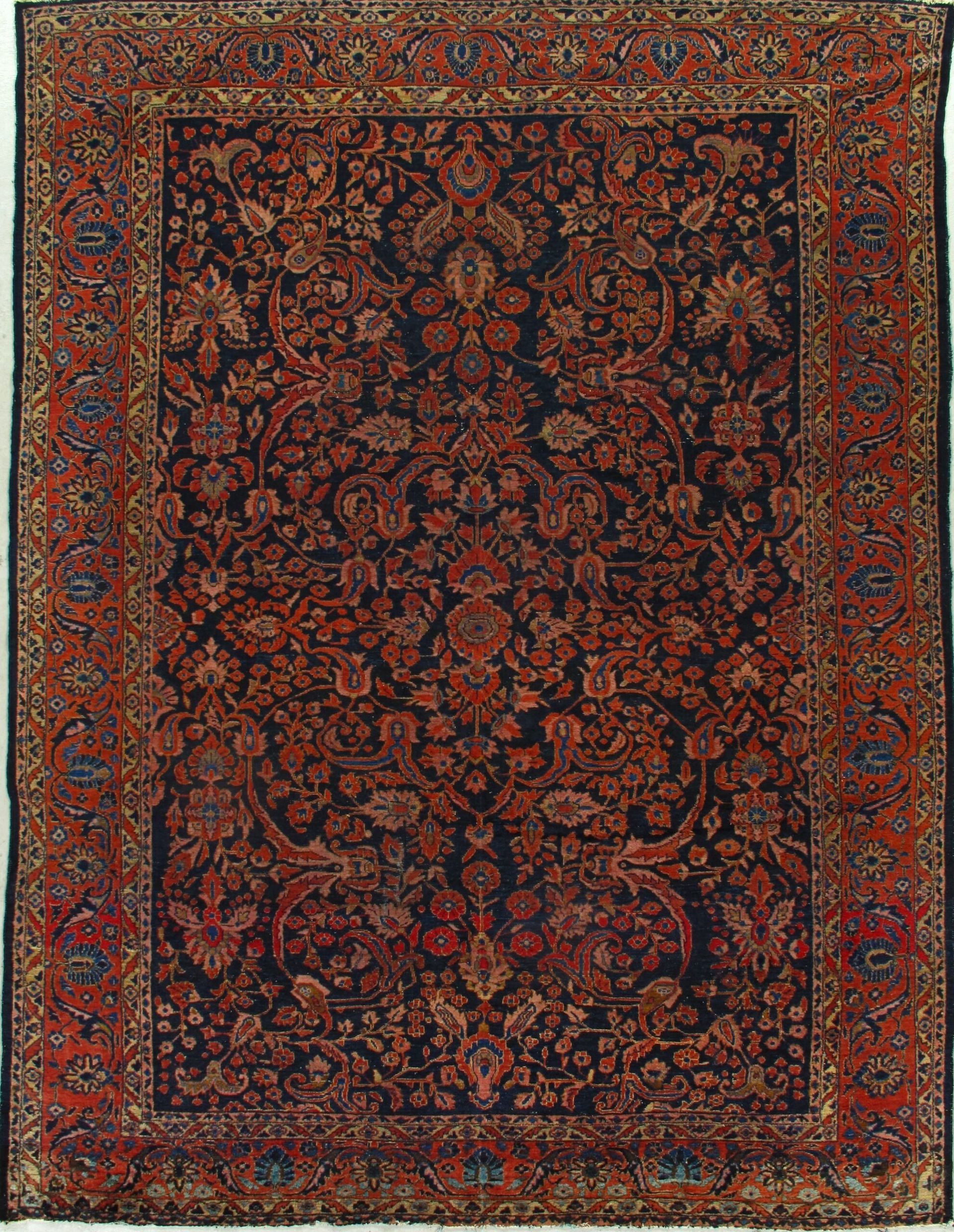 A red and black rug with a floral pattern on it