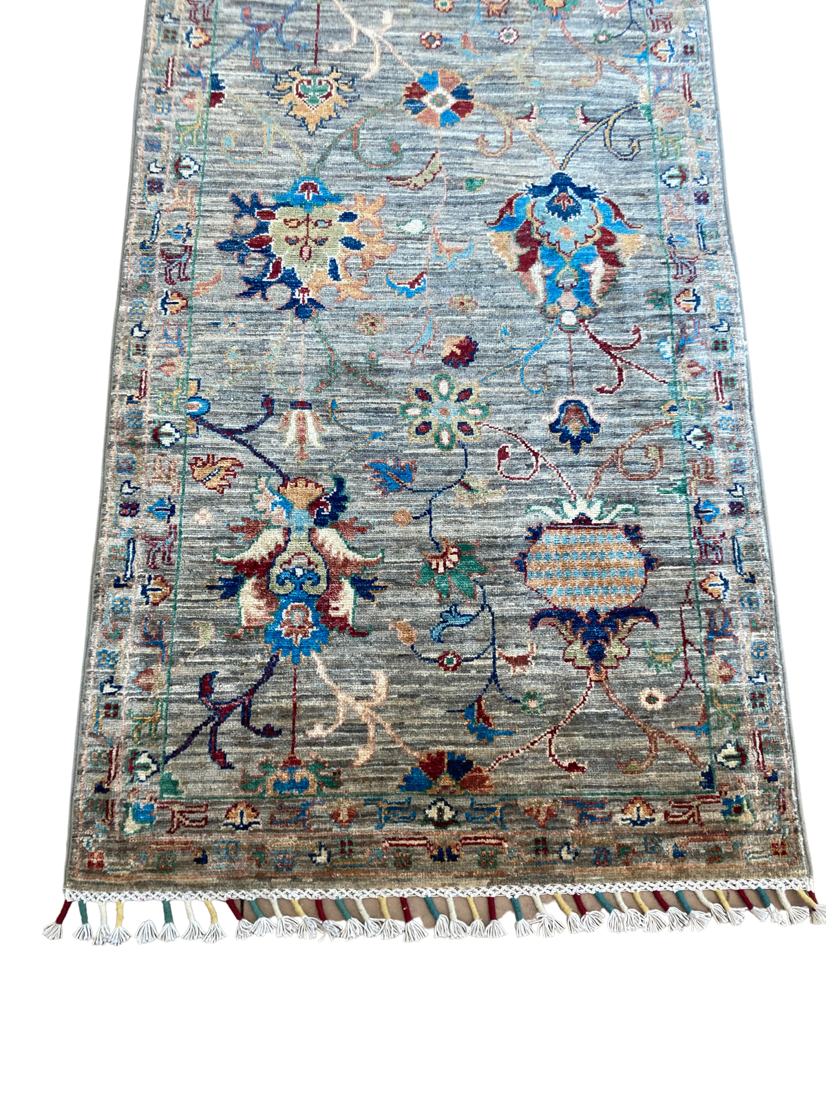 A long rug with a pattern on it is sitting on a table.