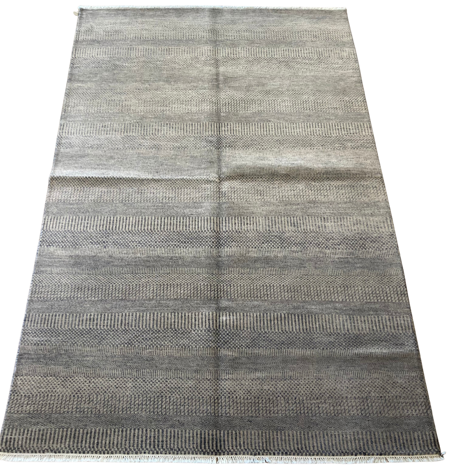 A rug with a pattern on it is on a white background.