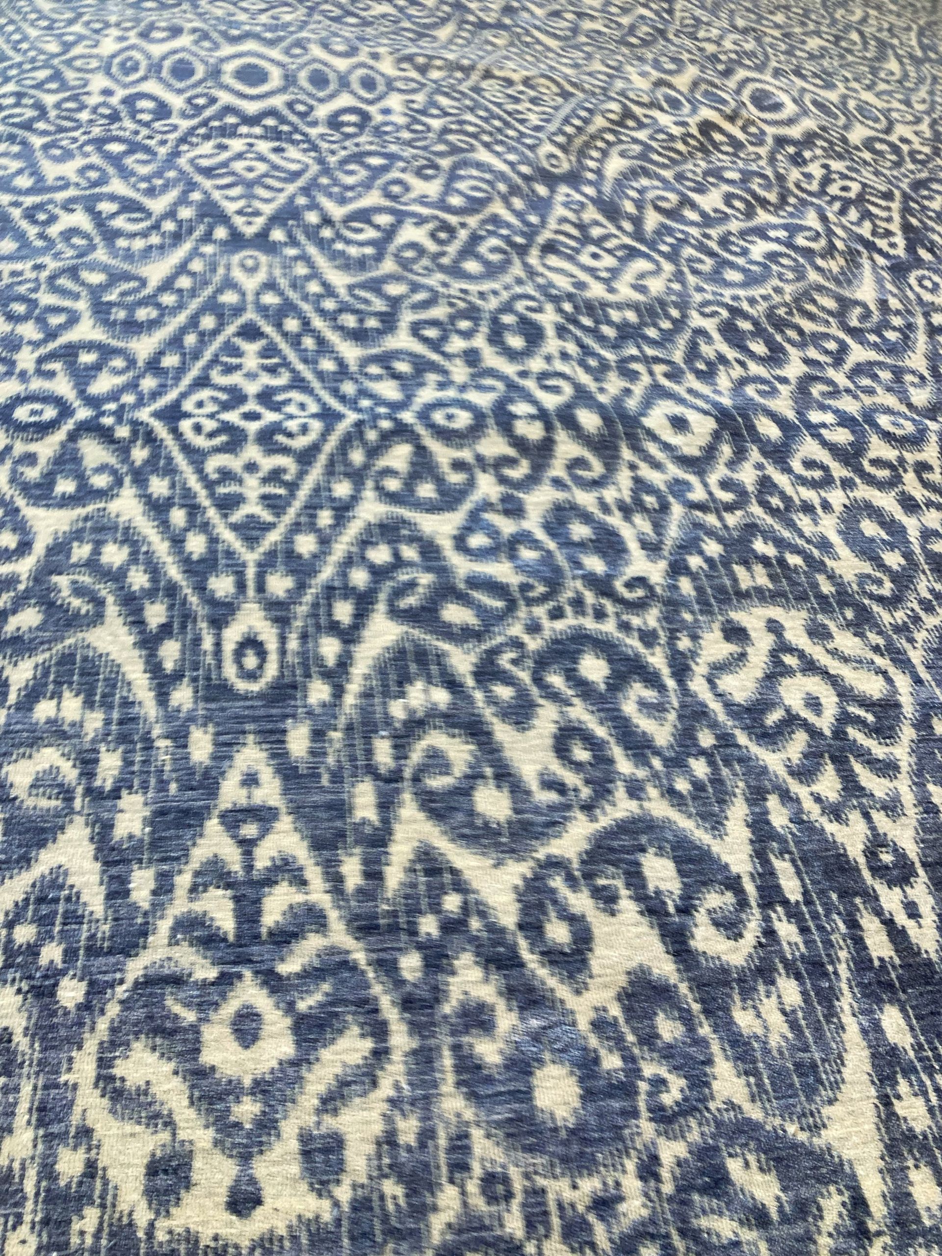 A rug with a pattern on it is on a white background.