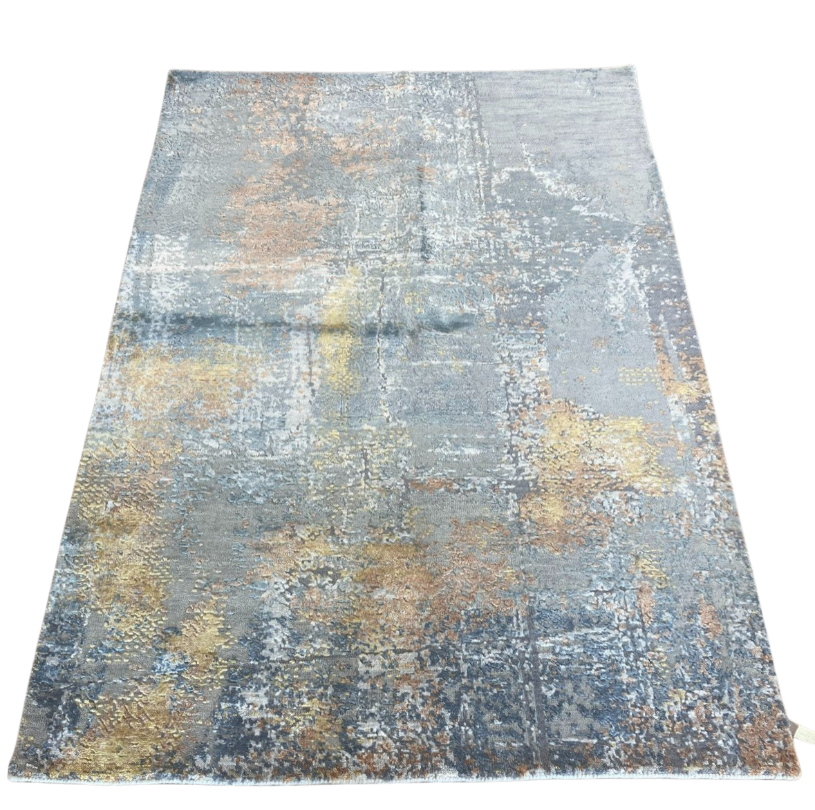 A rug with a gray and gold pattern on a white background.