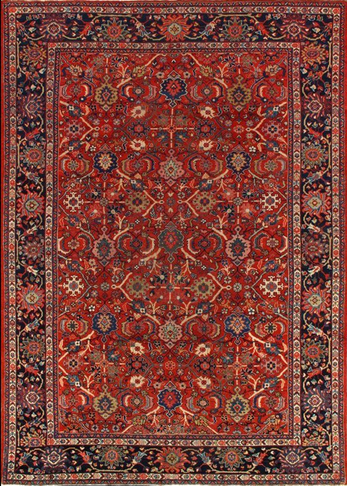 A red rug with a black border and a floral pattern on it.