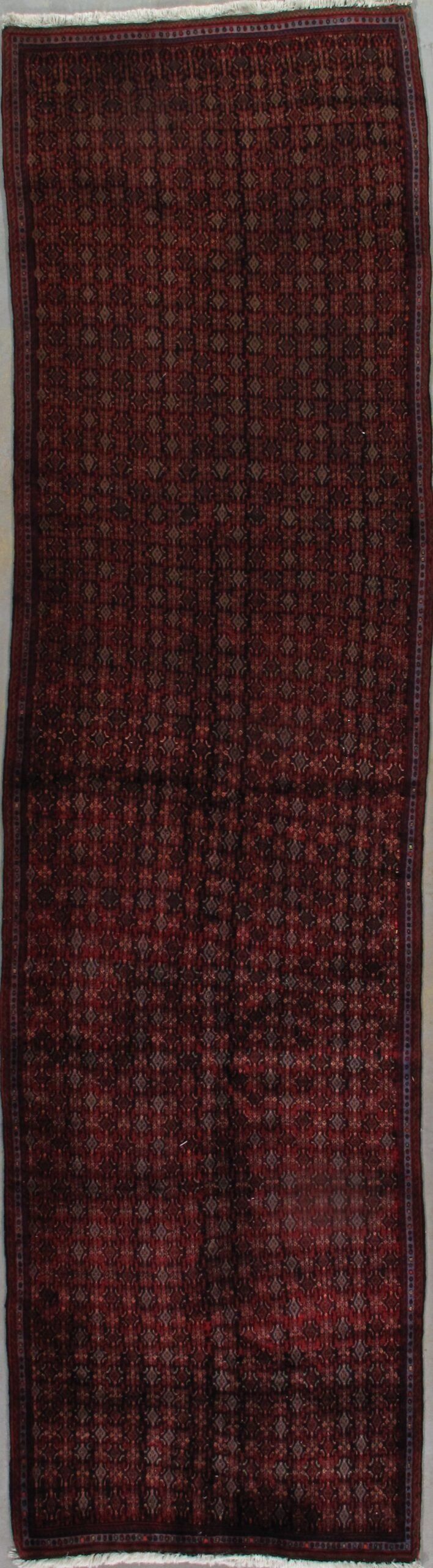 A close up of a piece of red fabric on a white surface.