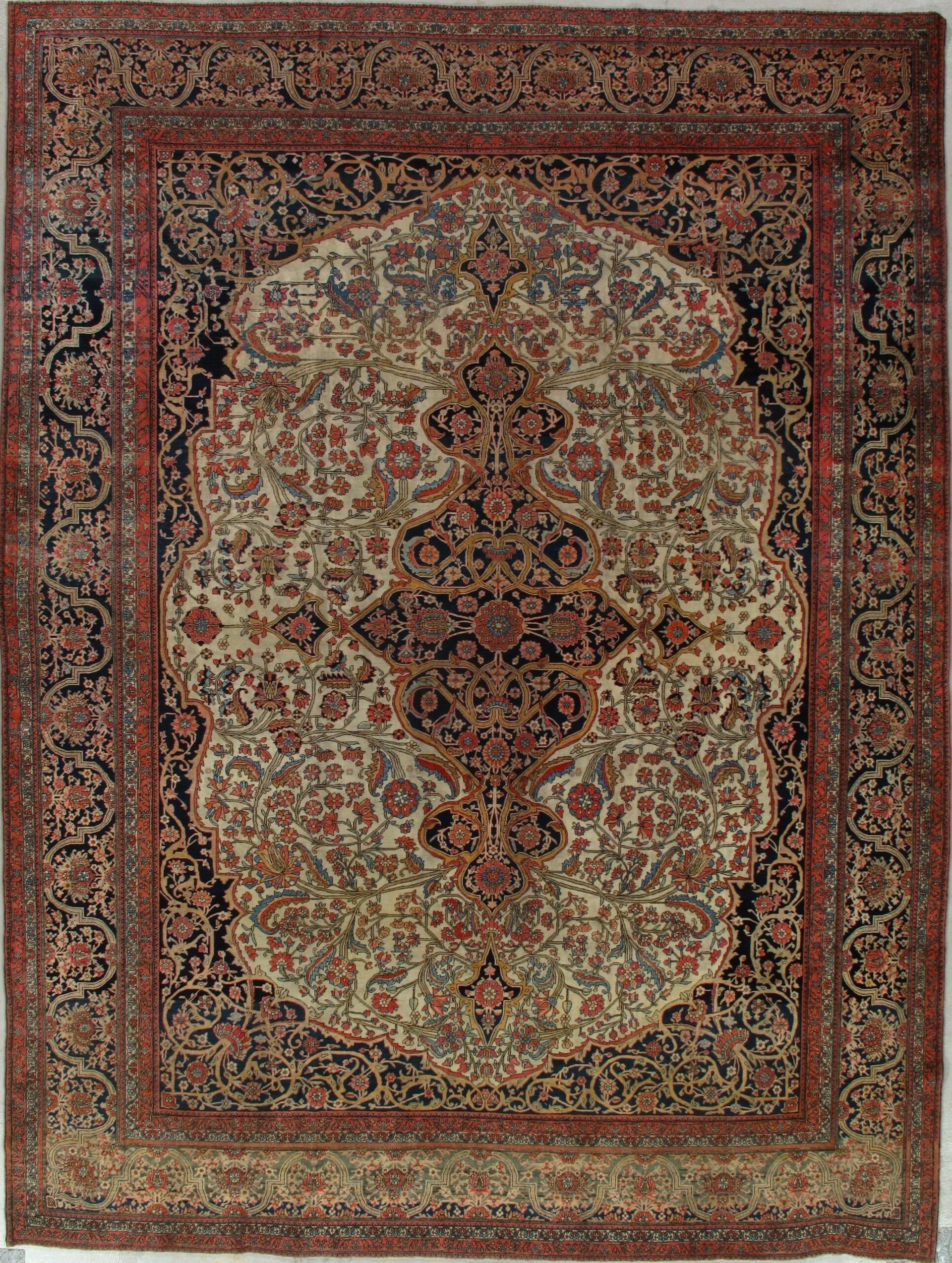 A rug with a floral pattern on it is hanging on a wall.