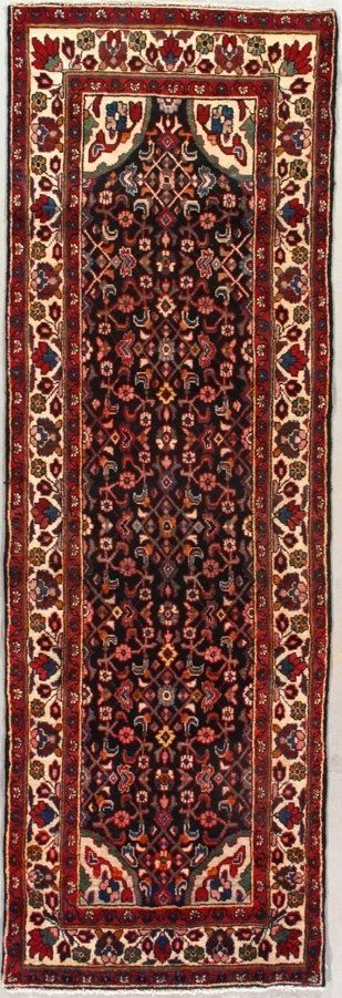 A rug with a floral pattern on it is on a white surface.