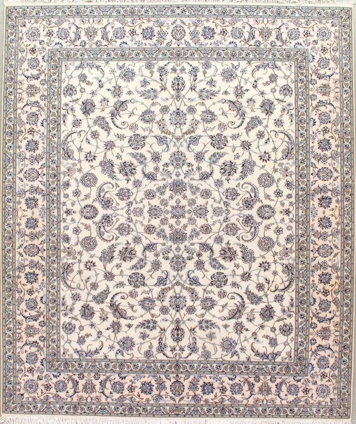 A white rug with a blue floral pattern on it.