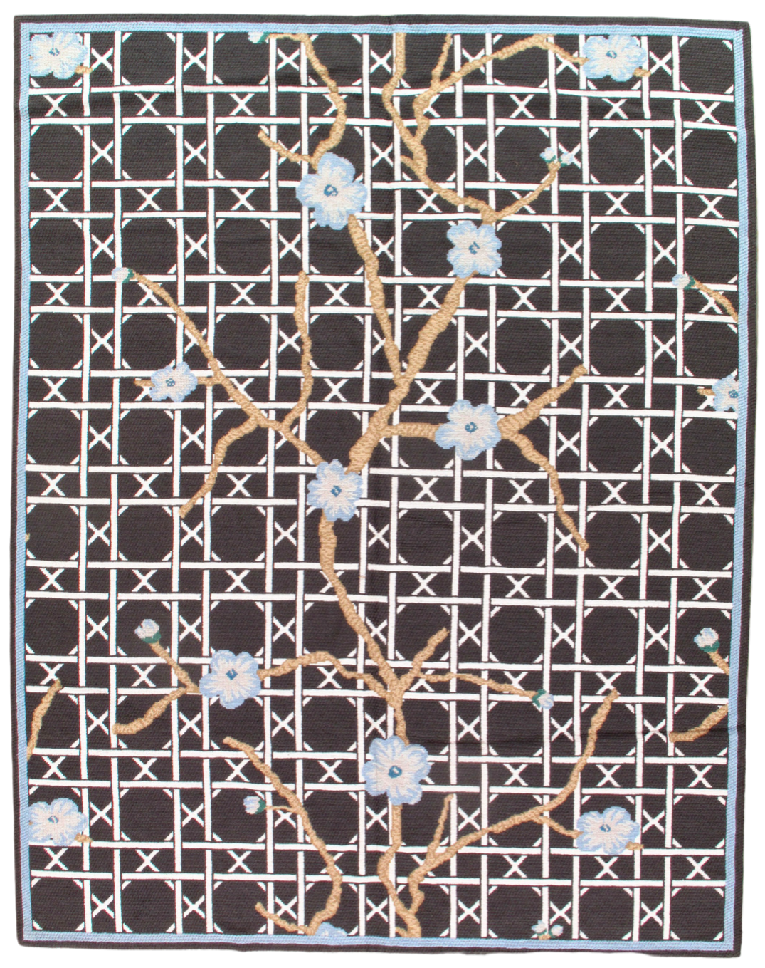 A black and white rug with flowers on it