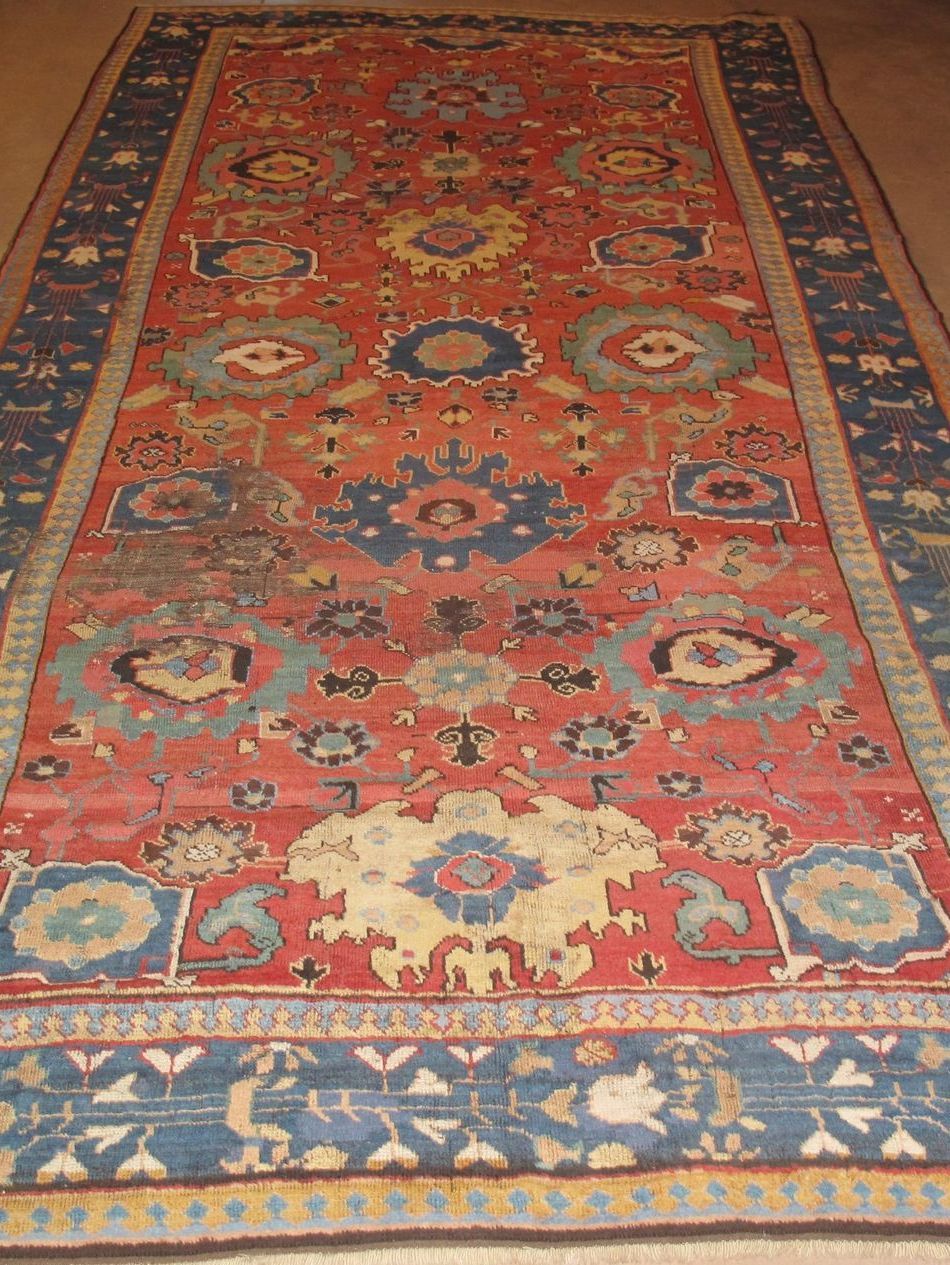 A red and blue rug is laying on the floor