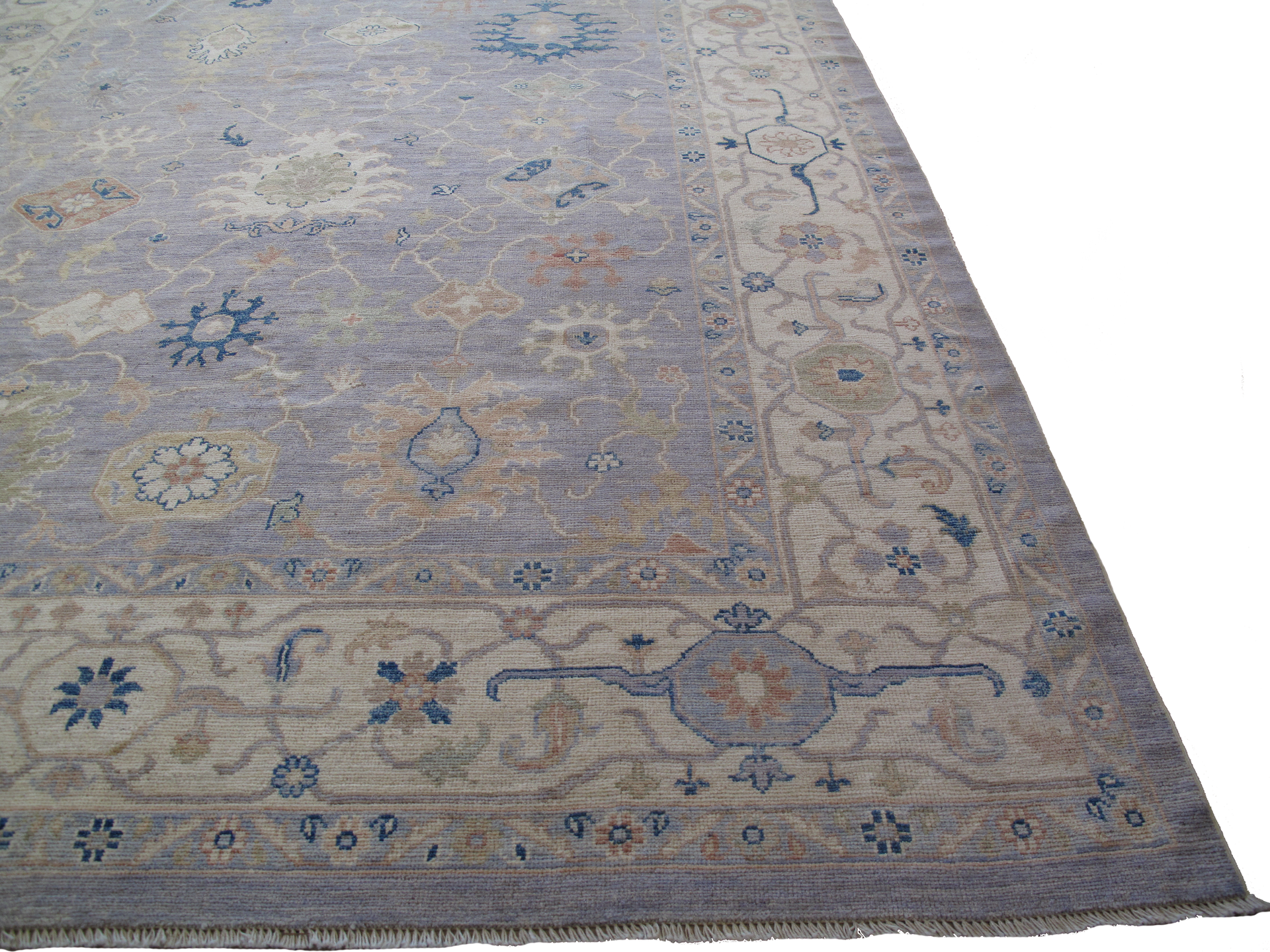 A rug with a floral pattern on it is on a white background.